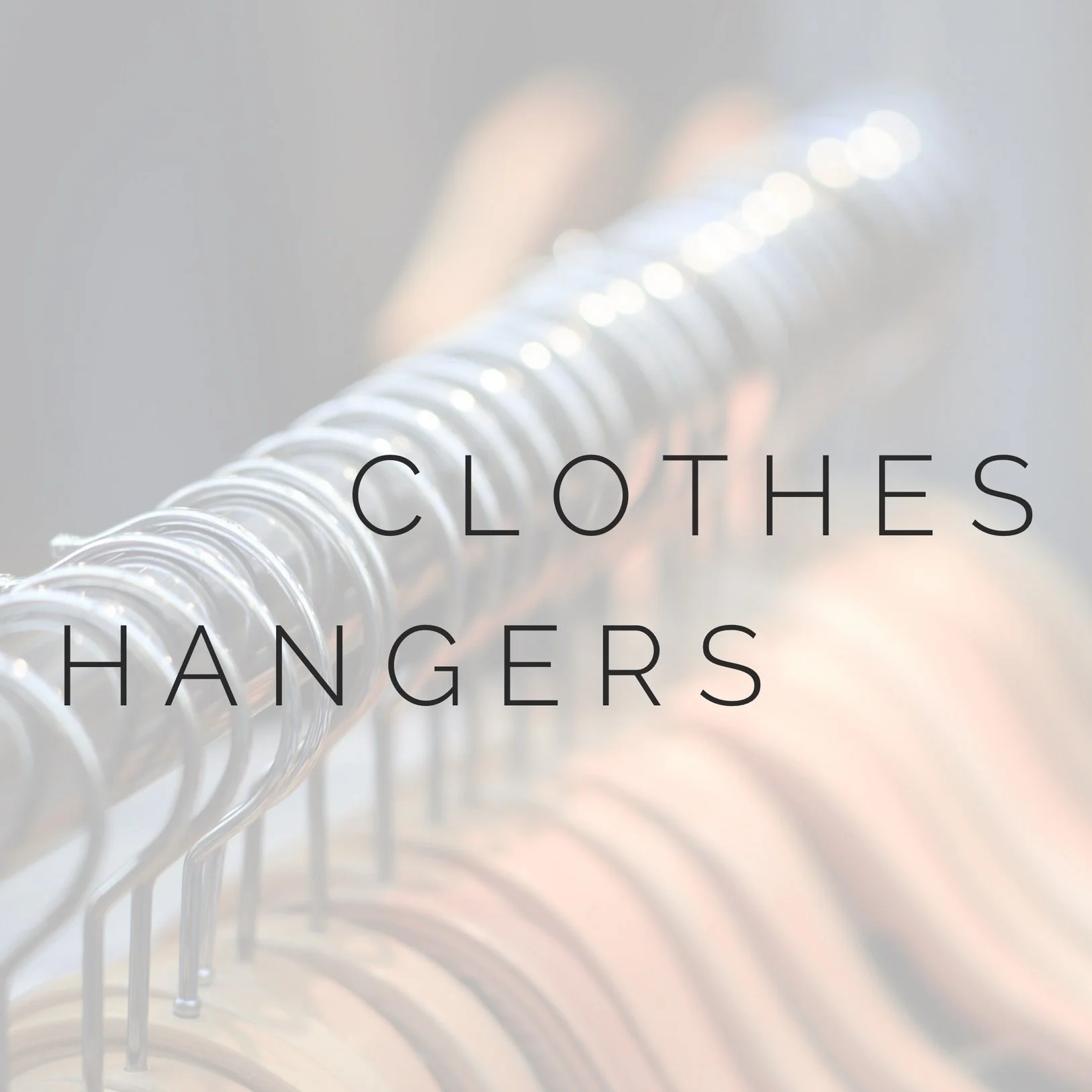 Row of matching clothes hangers with overlay text "clothes hangers".