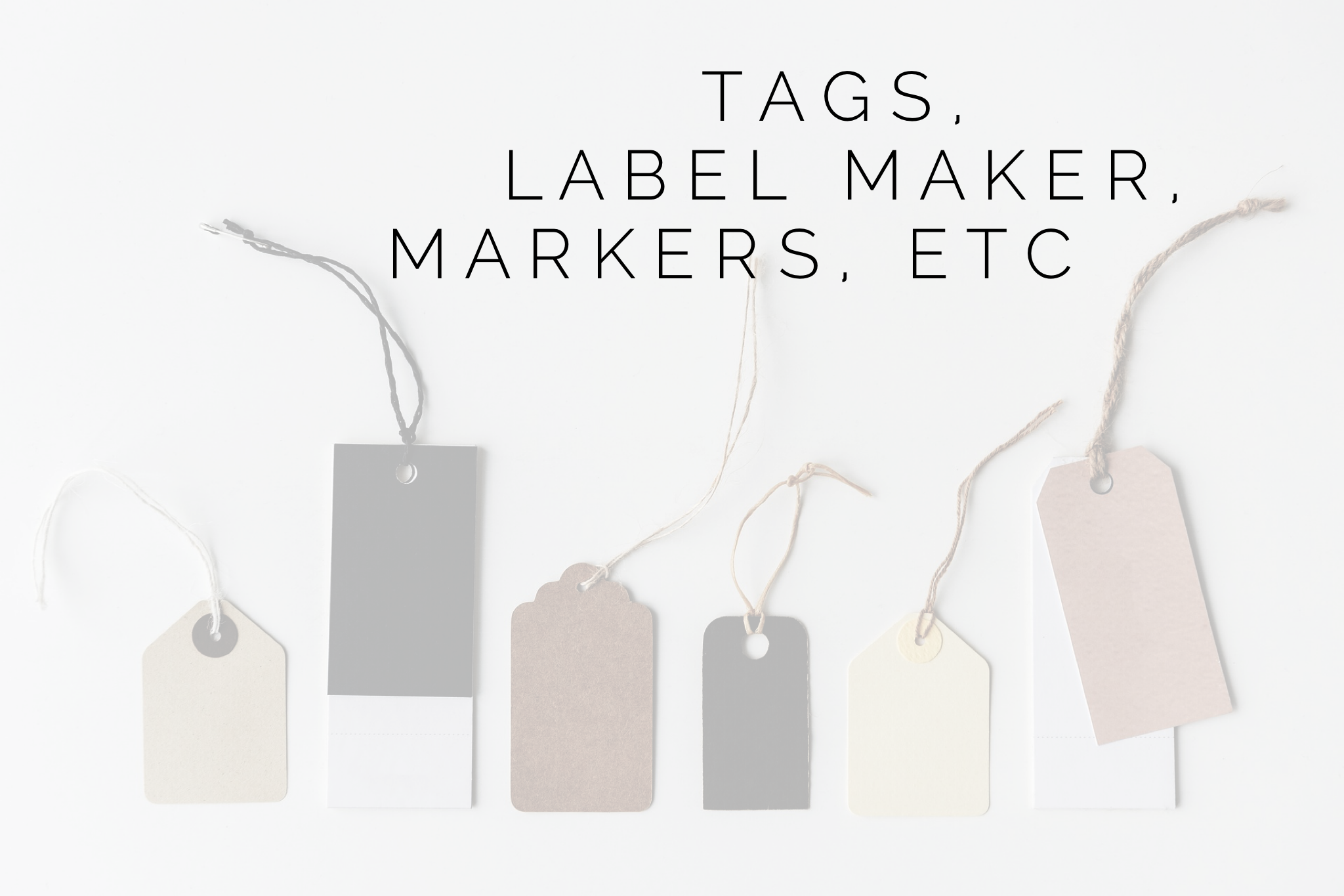 Assorted hanging tags with overlay text "tags, label maker, markers, etc".
