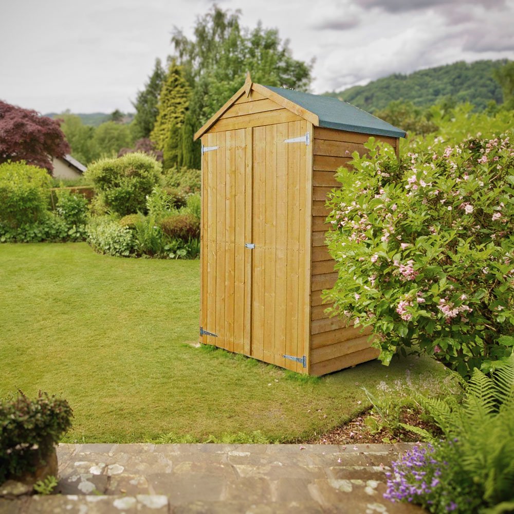 Shed blended into garden stock image.