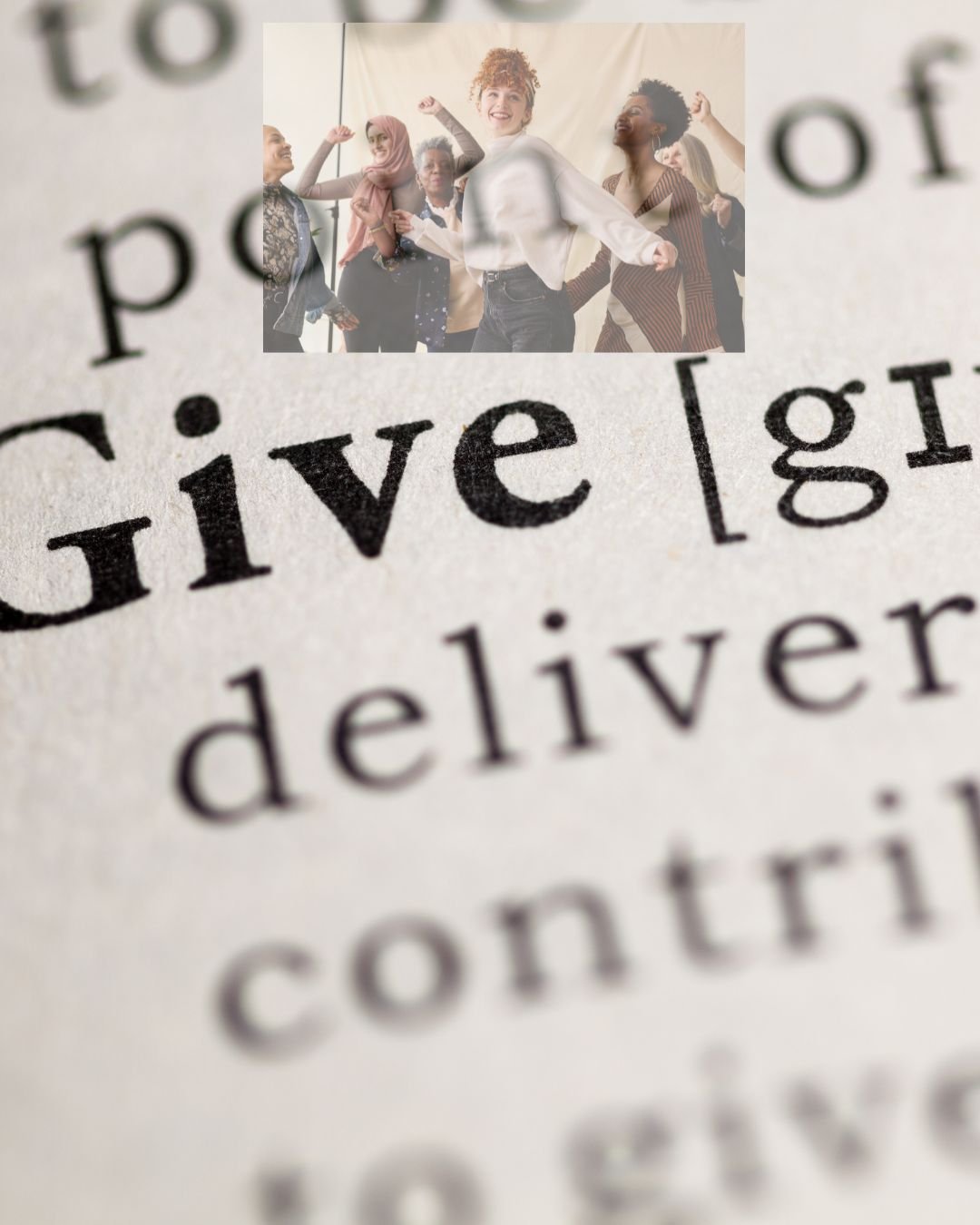 Close-up of dictionary page with the word 'give' and a photo of diverse women celebrating in the background.