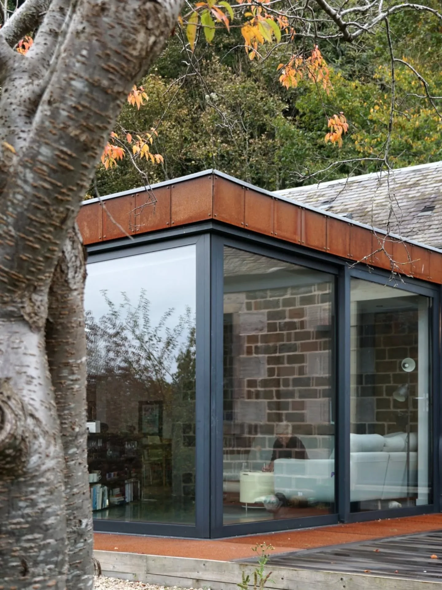 We've been back to visit a couple of our projects which both looked excellent in an autumnal setting. 

The first is a corten extension, which is a great compliment to the stone cottage, and alterations to a house in Perth. Corner opening sliding doo