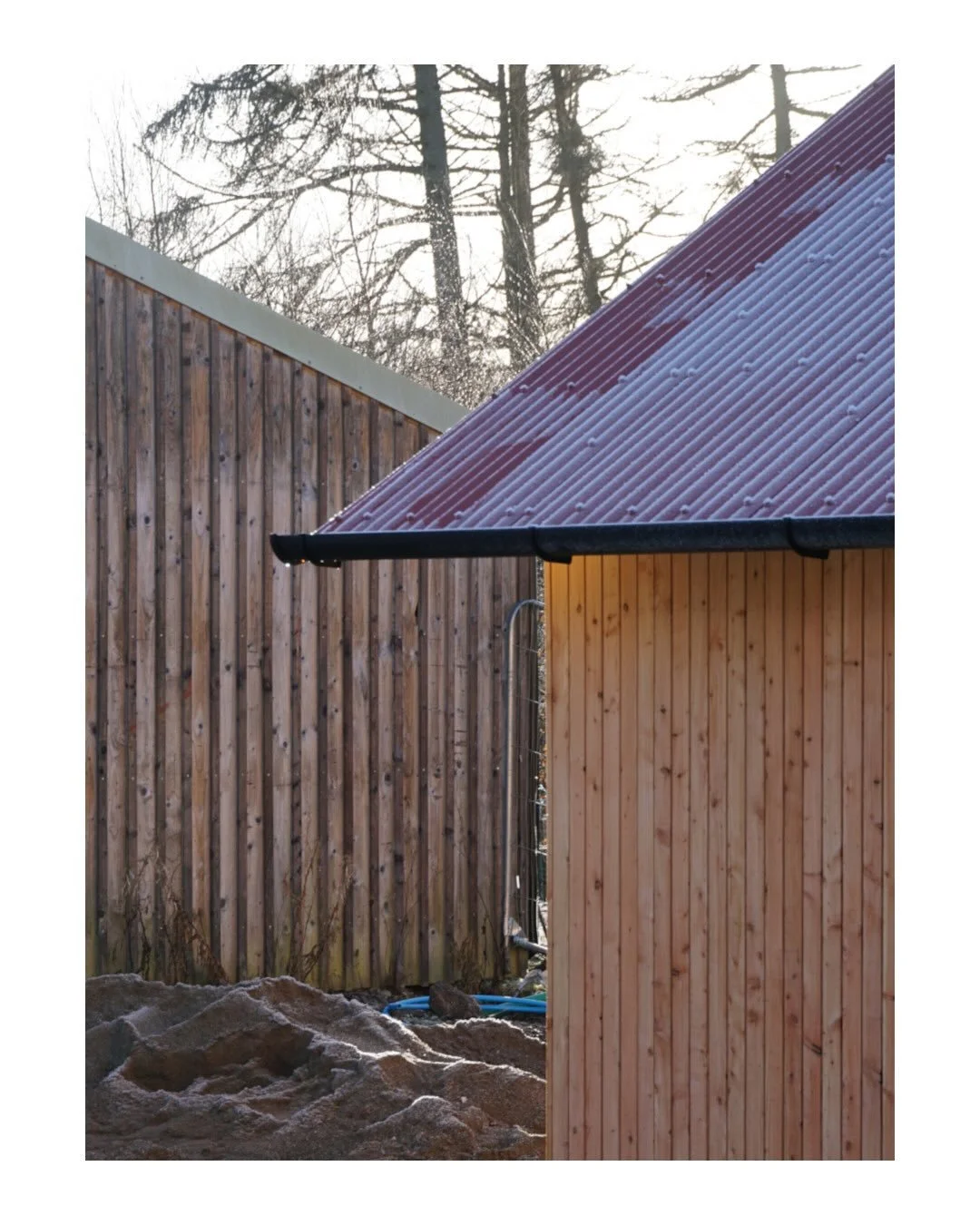 We&rsquo;re nearing completion of the Community Barn @corbeniccamphillcommunity 

@russwooduk open boarded vertical timber cladding is looking great in both the snow and the sun, and against the red corrugated roof. 

@calibre.systems aluminium doors