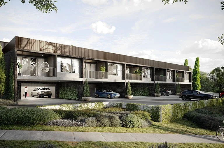 Modern apartment building with large windows, balconies, and landscaped greenery. Several cars are parked outside, and two people are visible near the entrance.