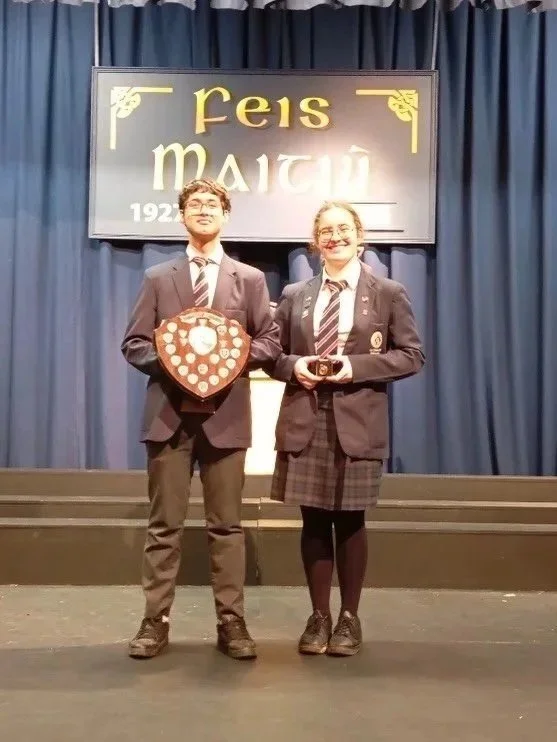 5th Year Le Chéile students Soovam and Gabi receiving the Kathleen O'Regan Perpetual Trophy