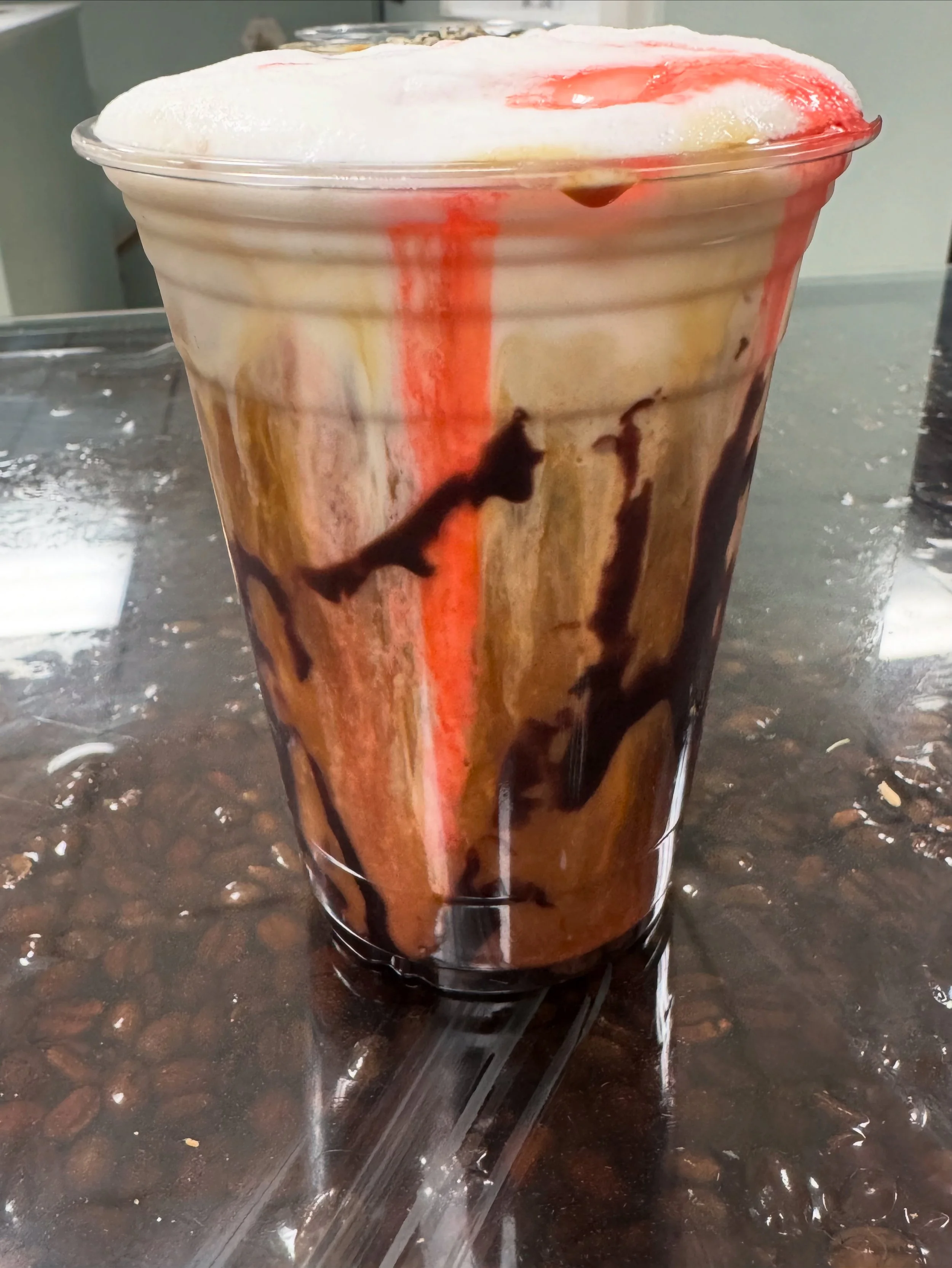 Jason Jolt -Columbian Brew  - Espresso - Carmel Syrup- Dark chocolate- Cayenne - Vanilla Cold Foam - Non-alcoholic Grenade 