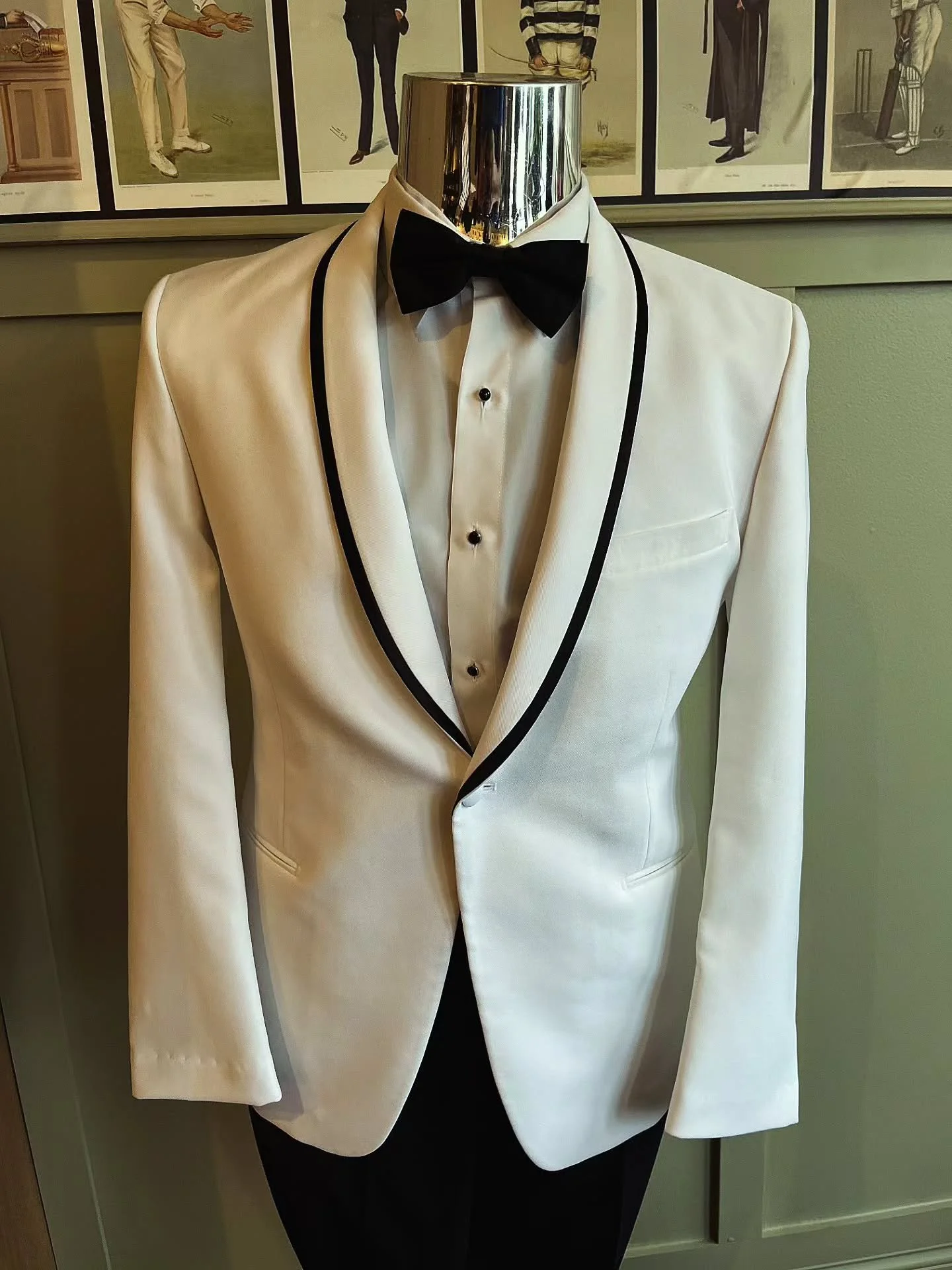 Not to be missed - an opportunity to add to your formal wardrobe with this fabulous tuxedo jacket!

SEPTEMBER SPECIAL BUY:

Ike Beher White Shawl Tuxedo Jacket with Black Trim
$50 final sale, $205 value

Available Sizes 34-52
Cash + Carry 

This is a