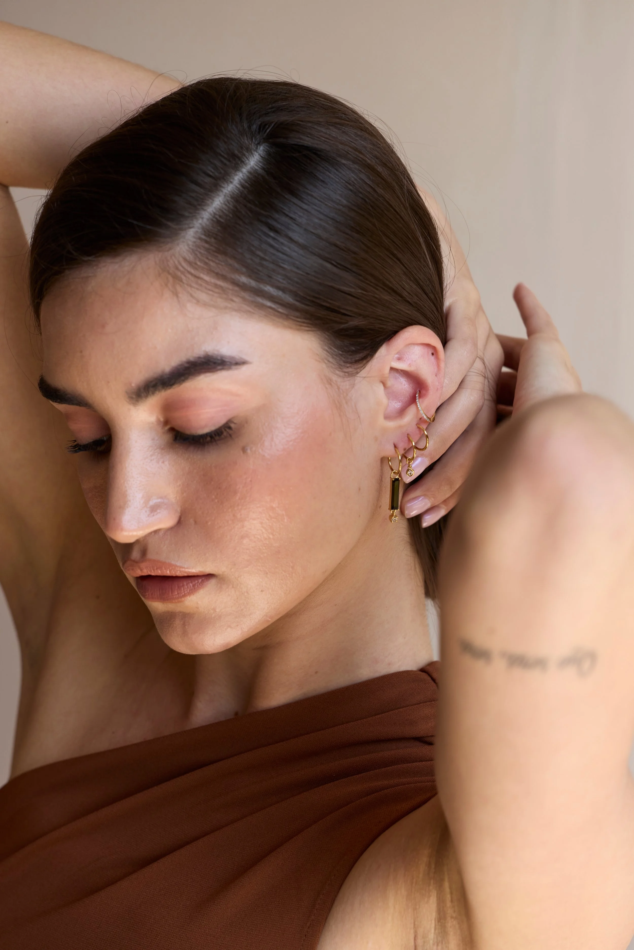 14K Solid gold hoops by Zikr Fine Jewelry.