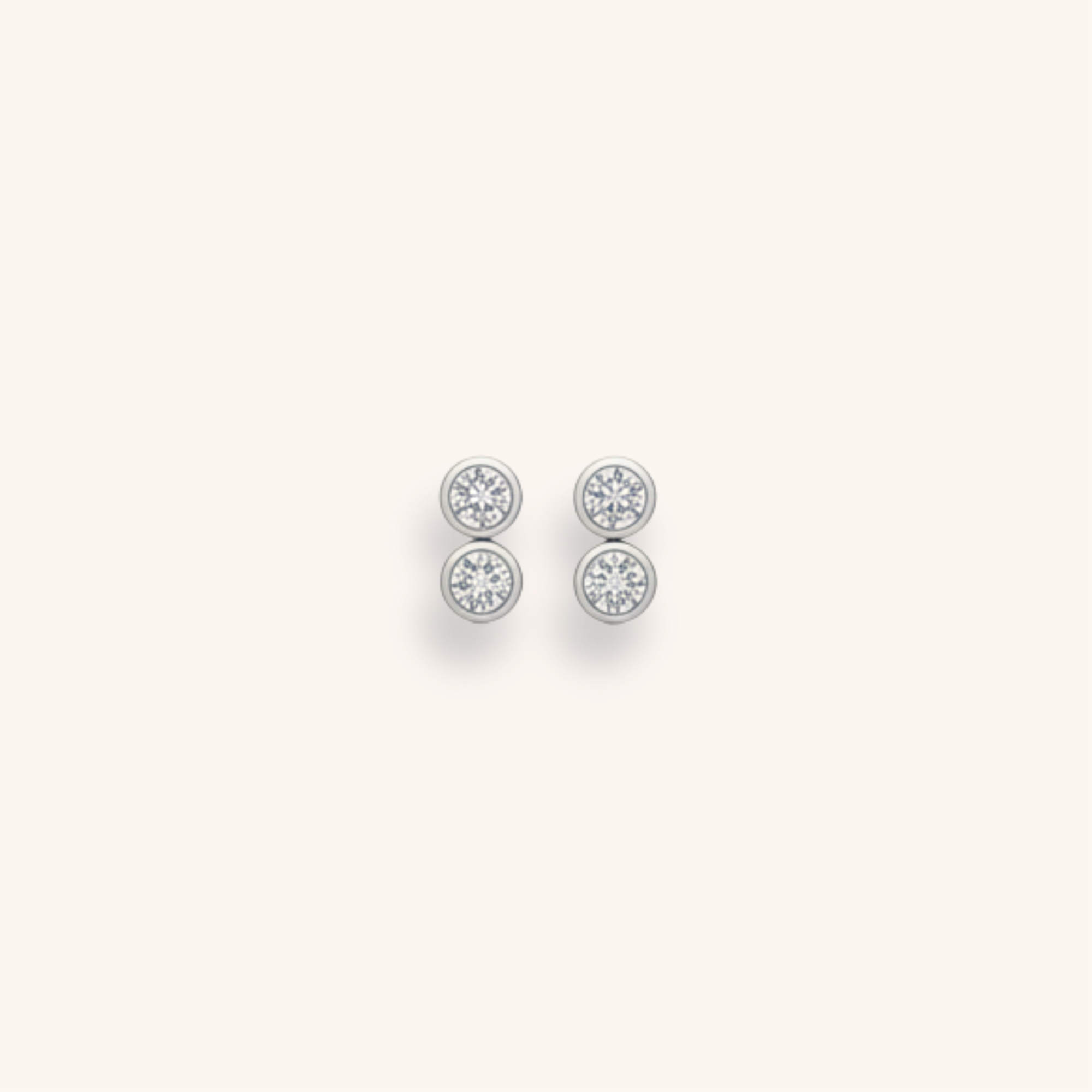 Pair of silver stud earrings with snowflake-like designs on a plain white background.
