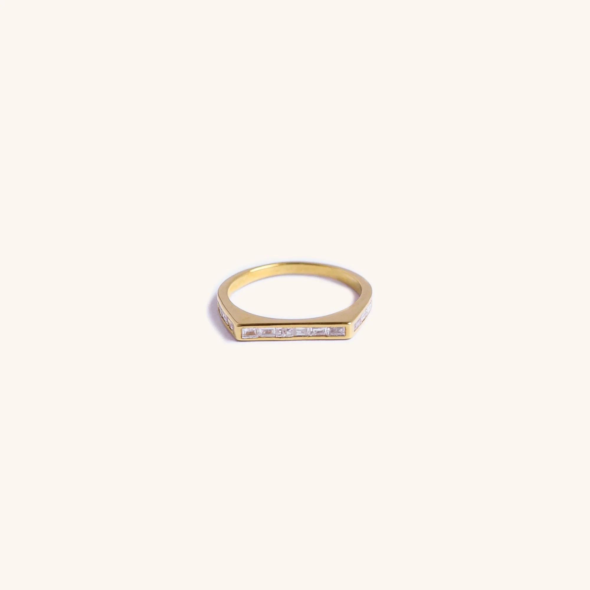 14K gold square band with emerald-cut diamonds by Zikr Fine Jewelry.