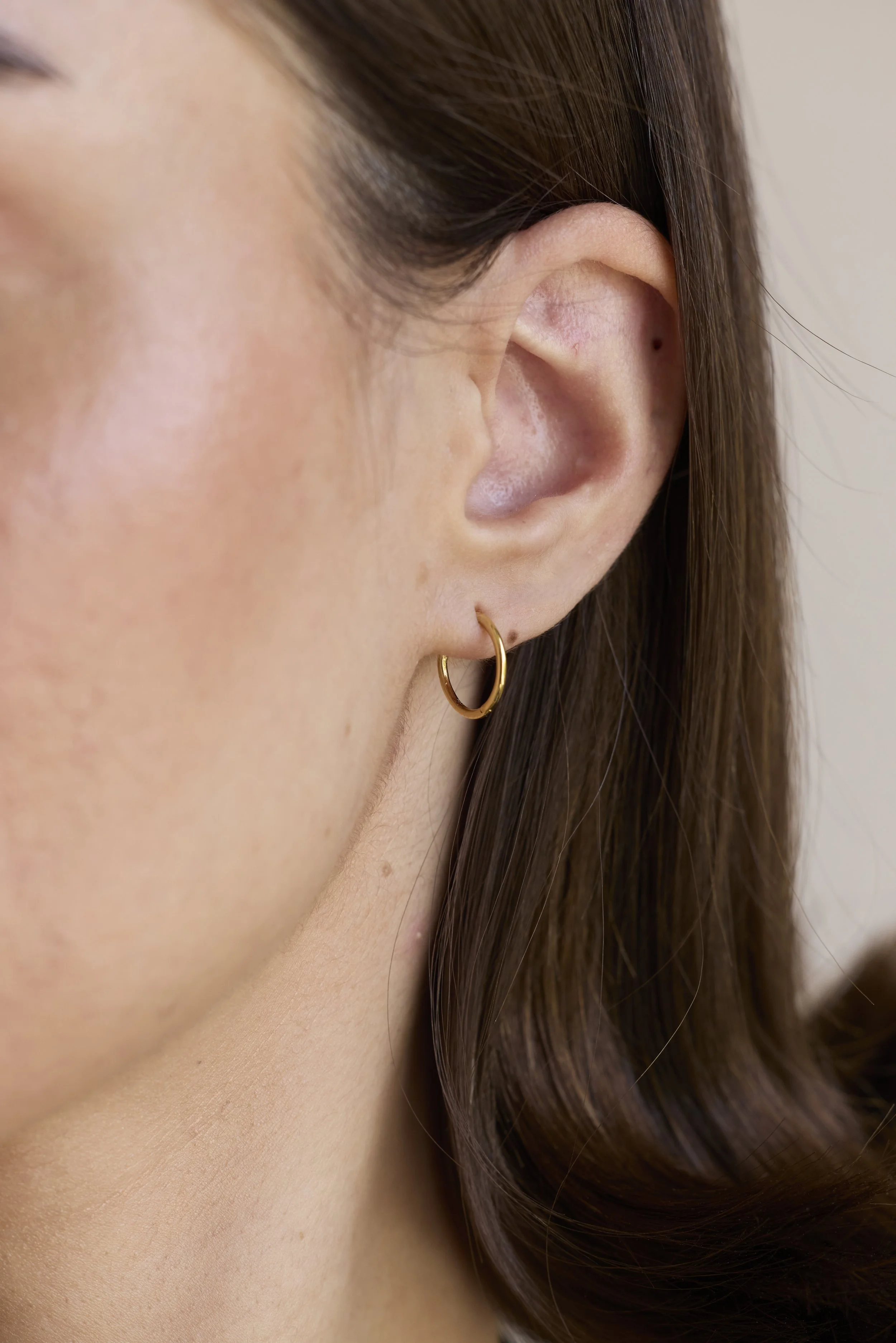 14K Solid gold hoops by Zikr Fine Jewelry.
