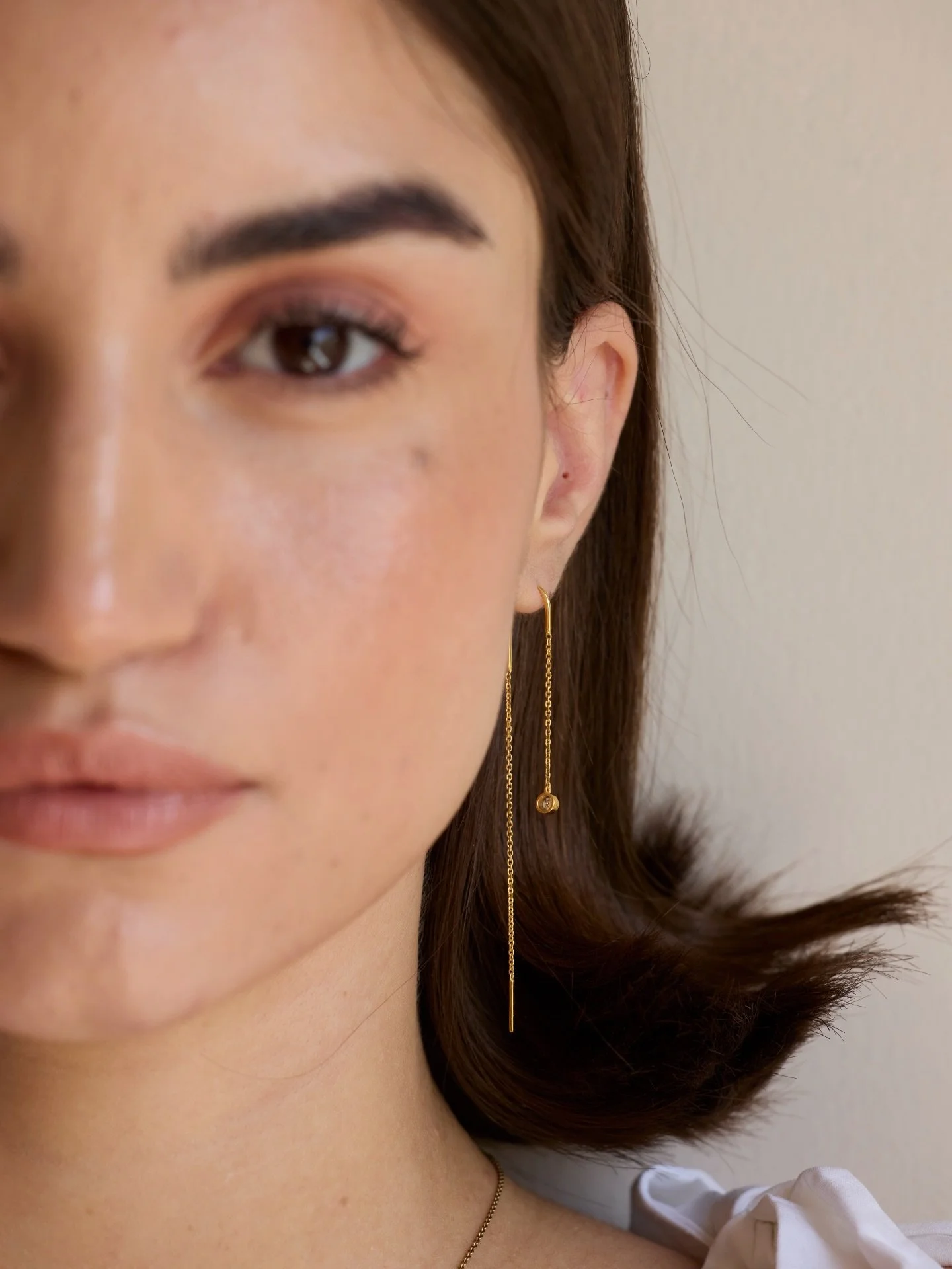 Fine 14K gold threader earrings finished with a delicate bezel set diamond for a soft, effortless sparkle. A modern essential for lovers of minimalist diamond jewelry and everyday gold earrings.

#GoldThreaderEarrings #BezelDiamondEarrings #14KGoldJe