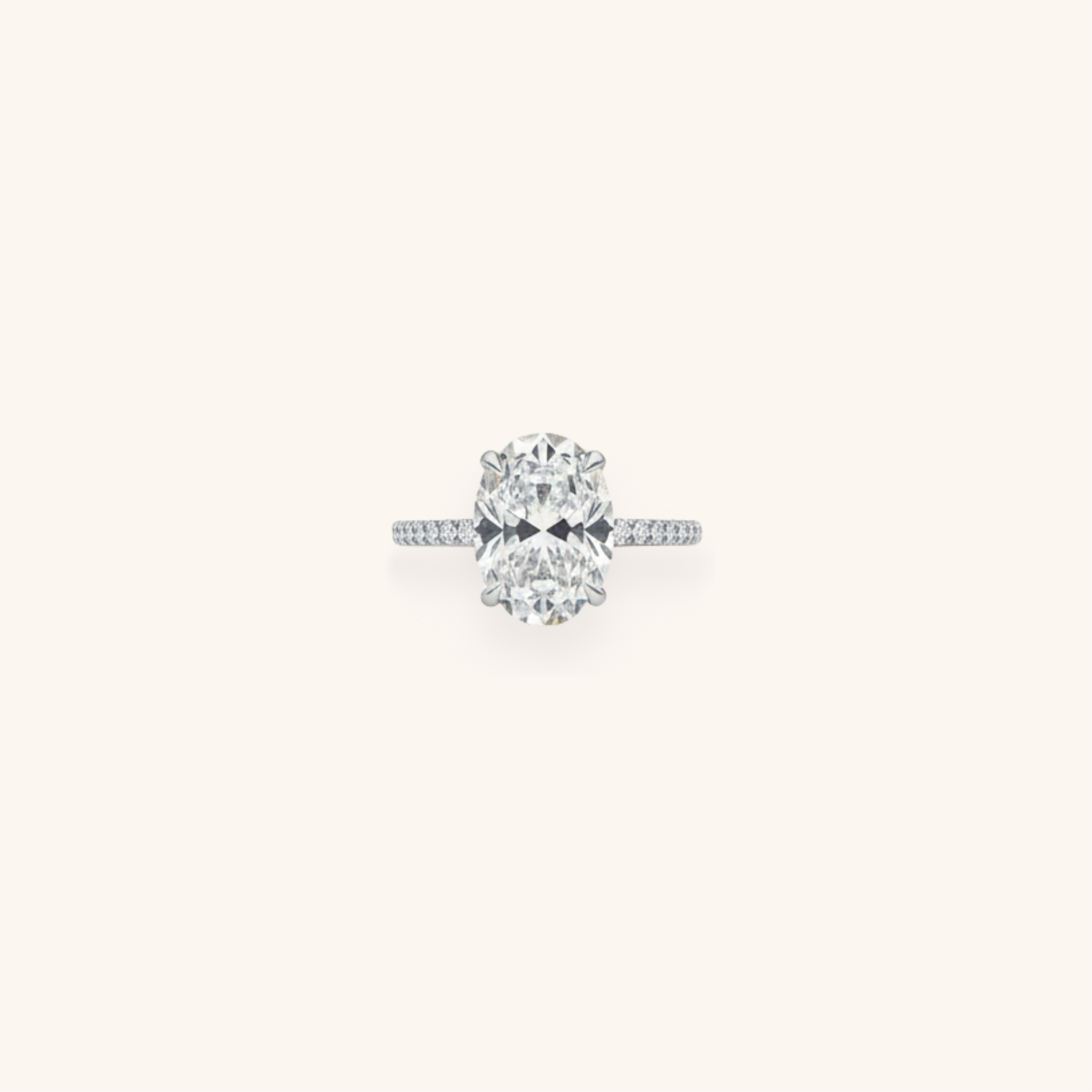 Diamond engagement ring with an oval-shaped center stone and a diamond-studded band.