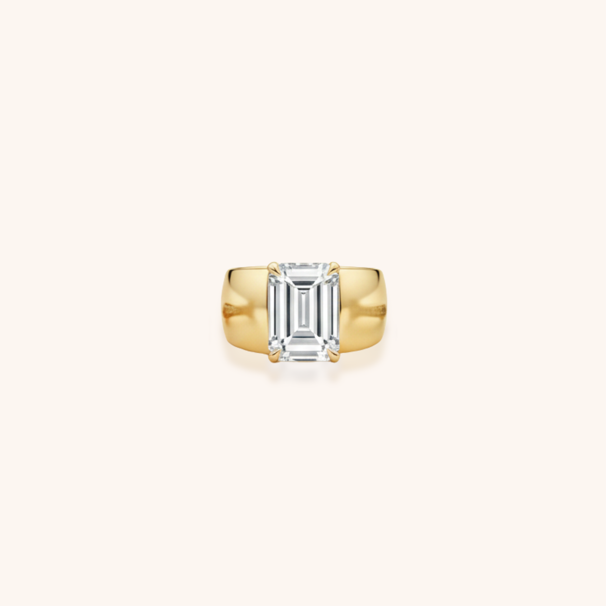 Gold ring with a large rectangular cut diamond in the center.