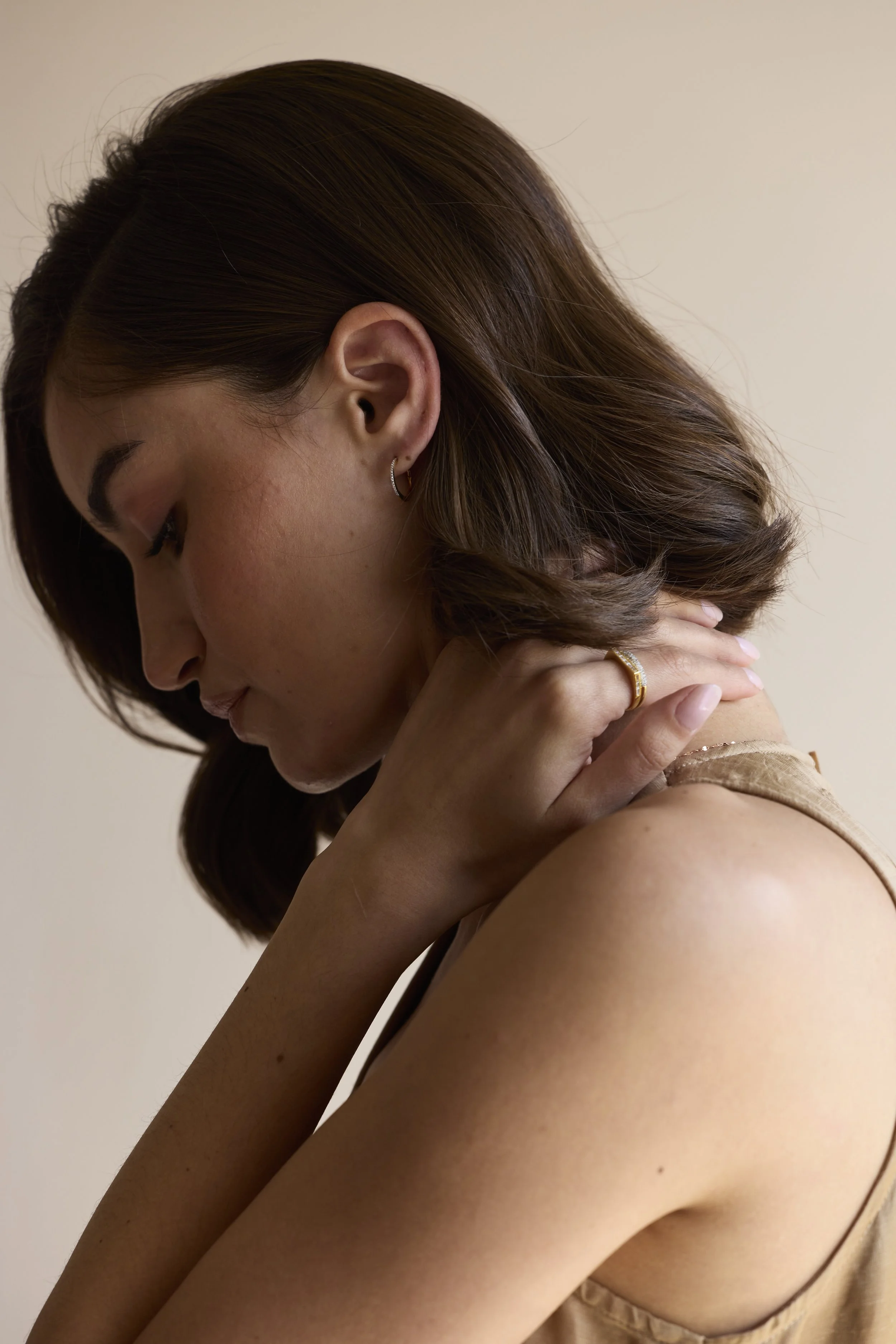 14K Solid gold hoops with diamonds featuring hand-cut diamonds by Zikr Fine Jewelry.