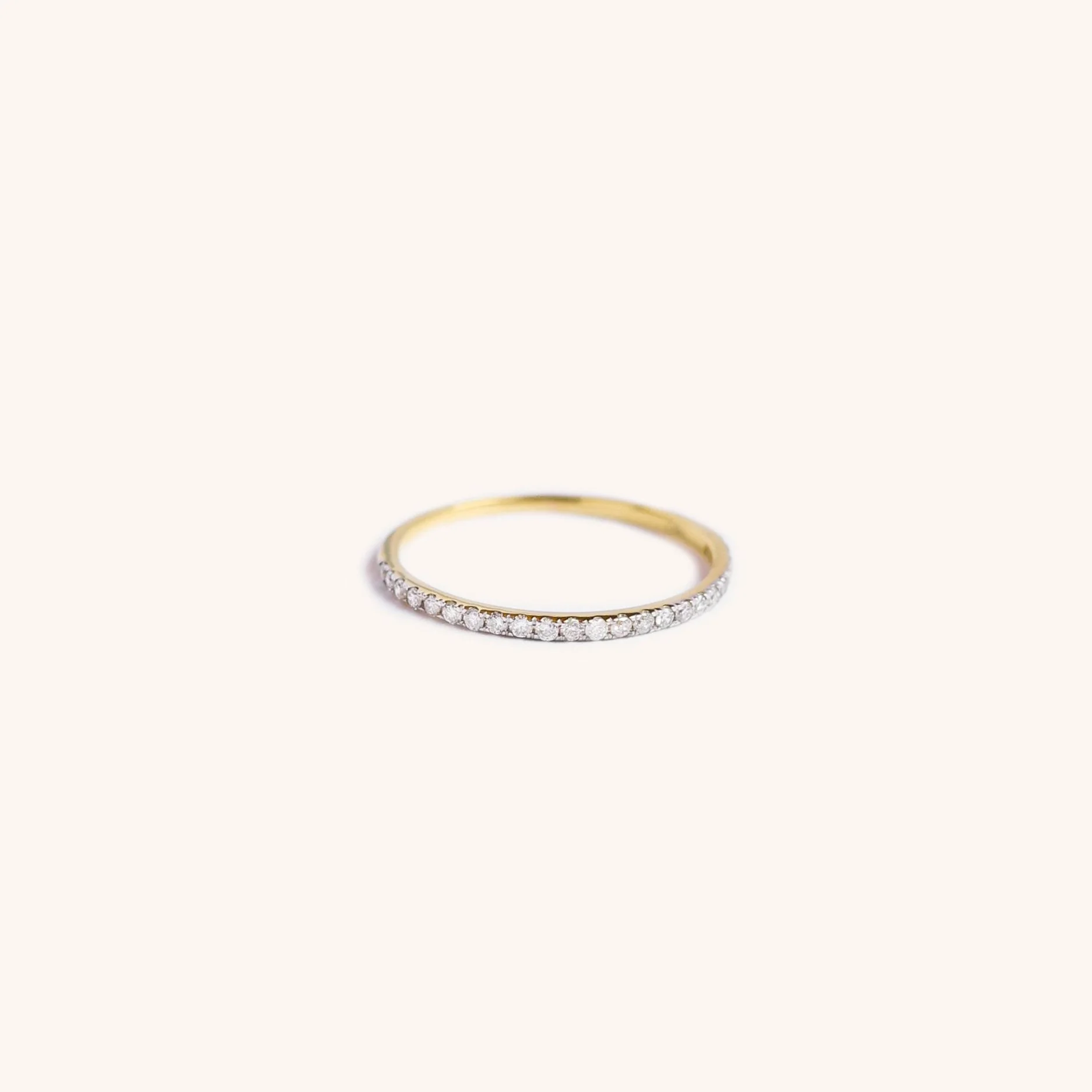 14K gold eternity band with diamonds, handmade fine jewelry by Zikr Fine Jewelry.