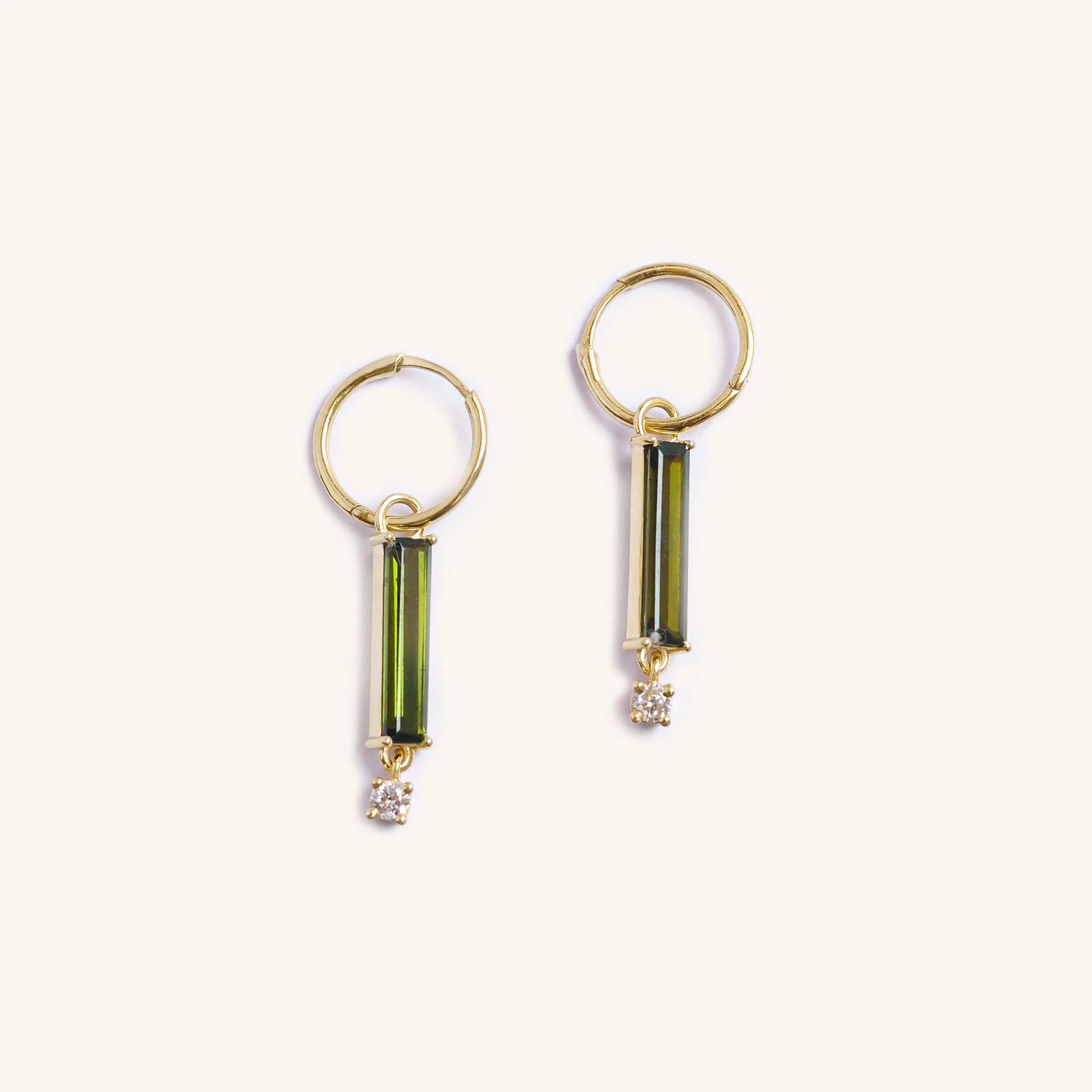 14K gold earrings featuring a green tourmaline gemstone paired with a brilliant diamond, handmade fine jewelry by Zikr Fine Jewelry