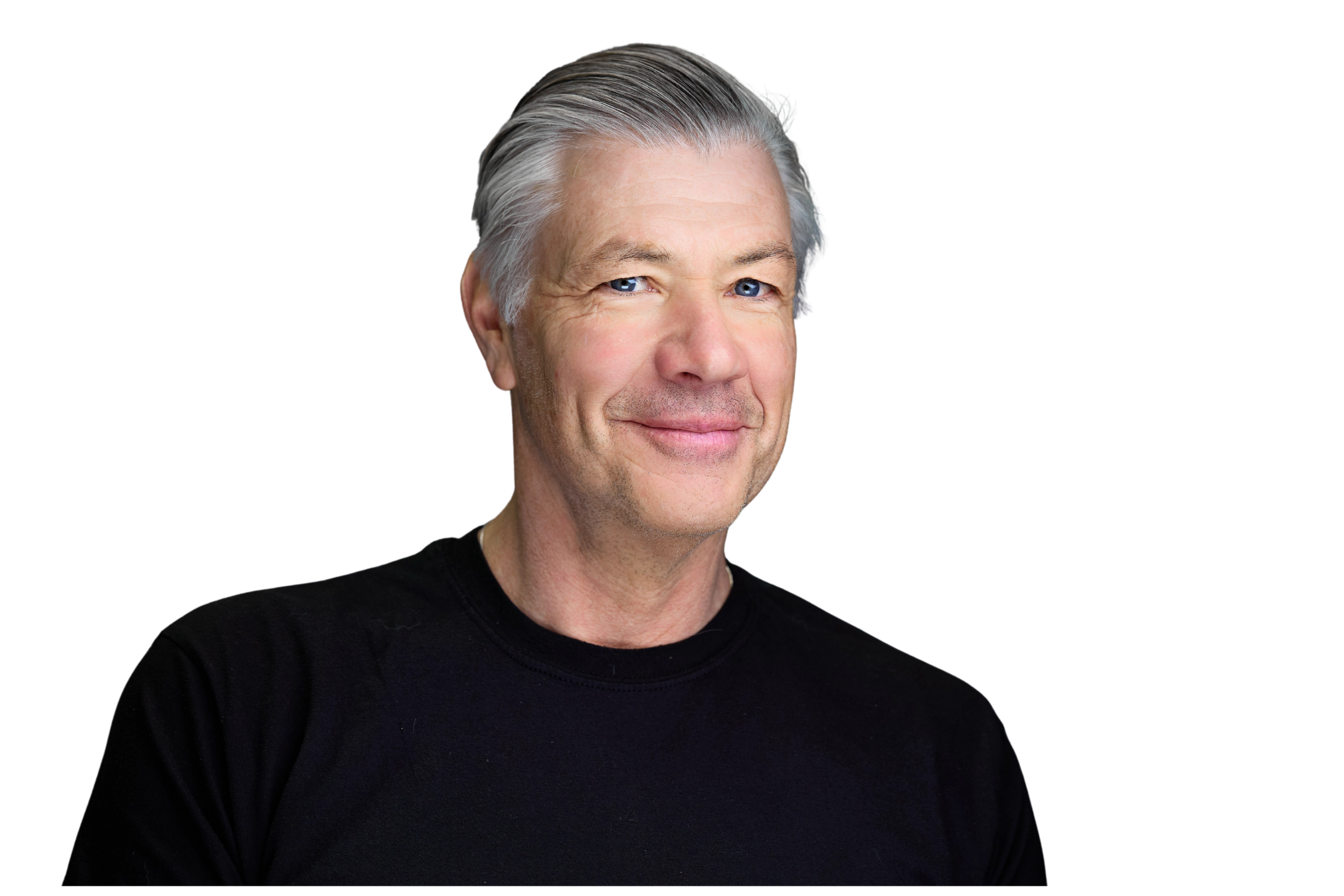 A middle-aged man with silver hair and blue eyes is smiling, wearing a black shirt against a black background.