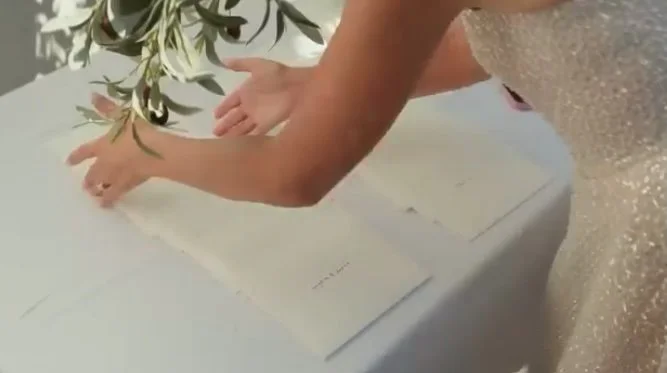 Amber laying out all the envelopes for guests before the ceremony