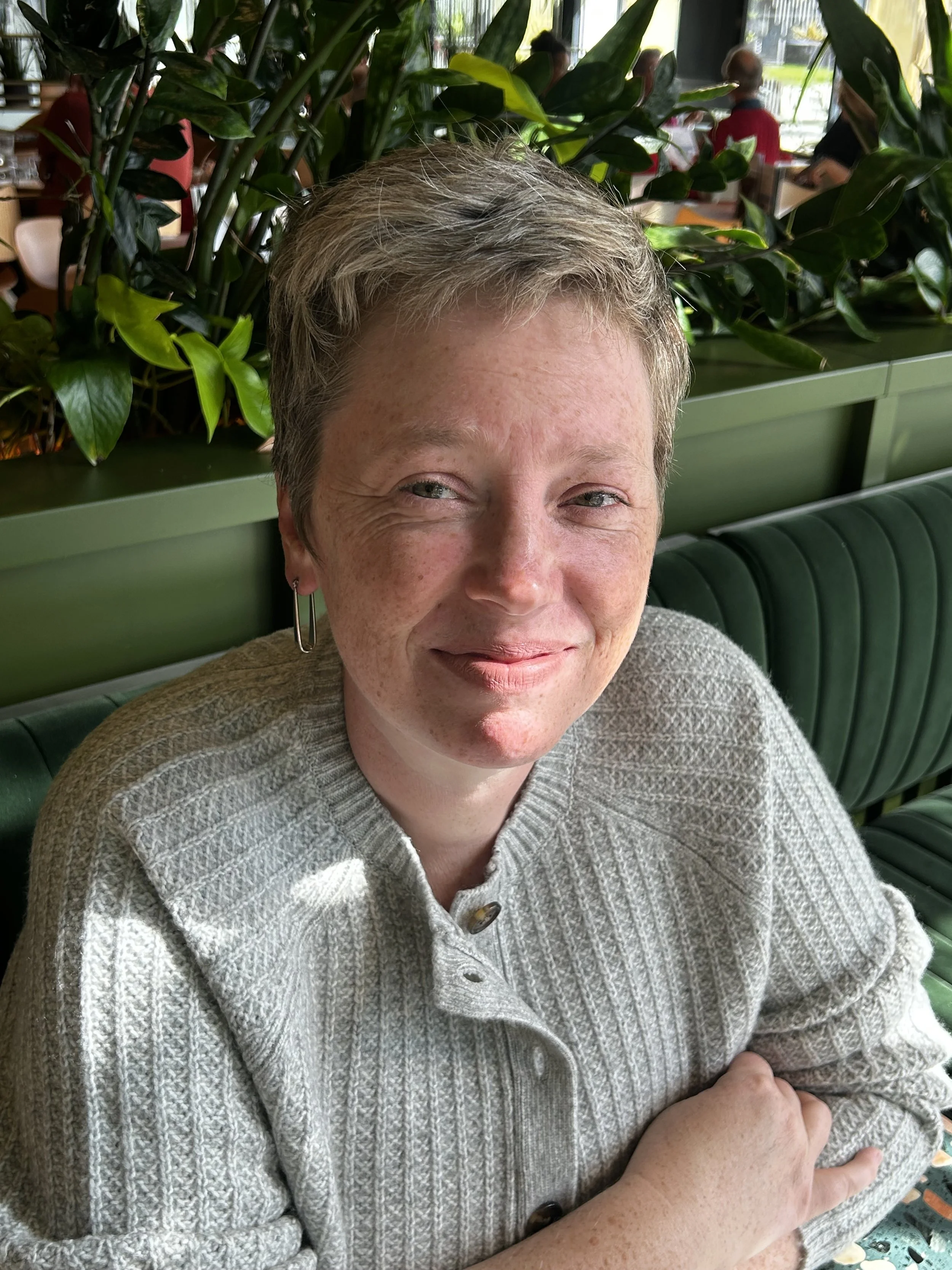 Picture of woman smiling at camera, tight shot