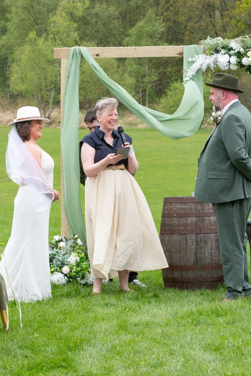 Sinéad Laffan sharing a moment with a couple during their wedding ceremony