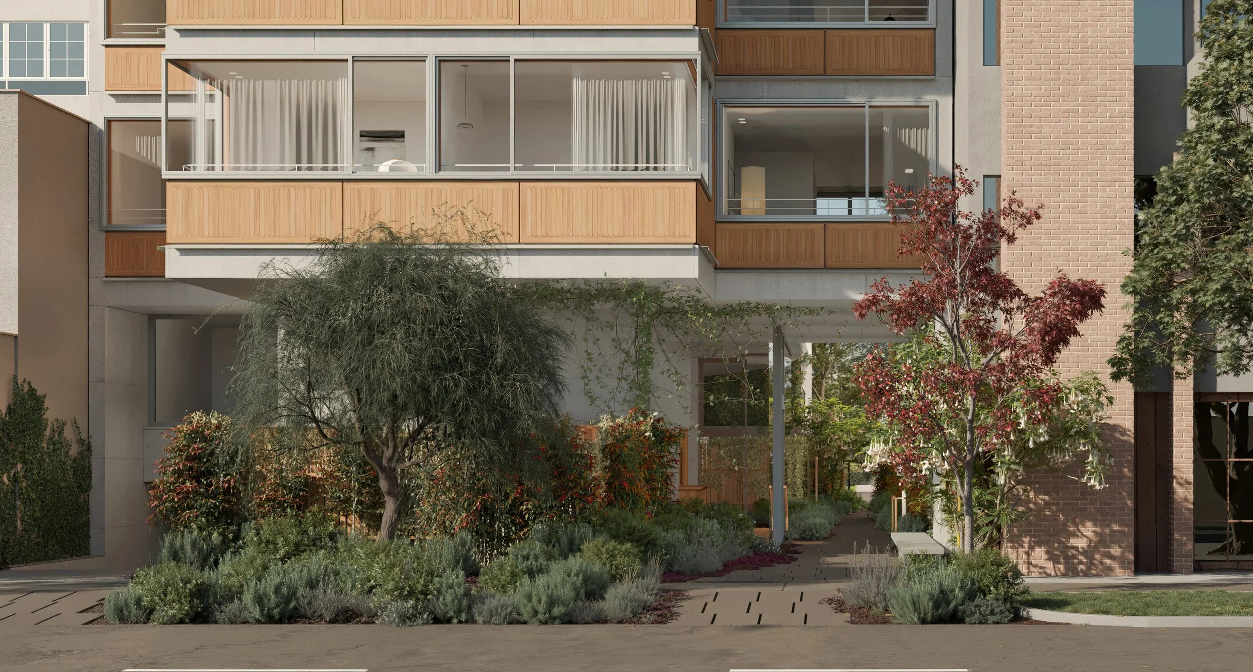 Edificio moderno con fachada de ladrillo y madera, con ventanas amplias y un área de jardín con árboles y arbustos en la parte frontal.
