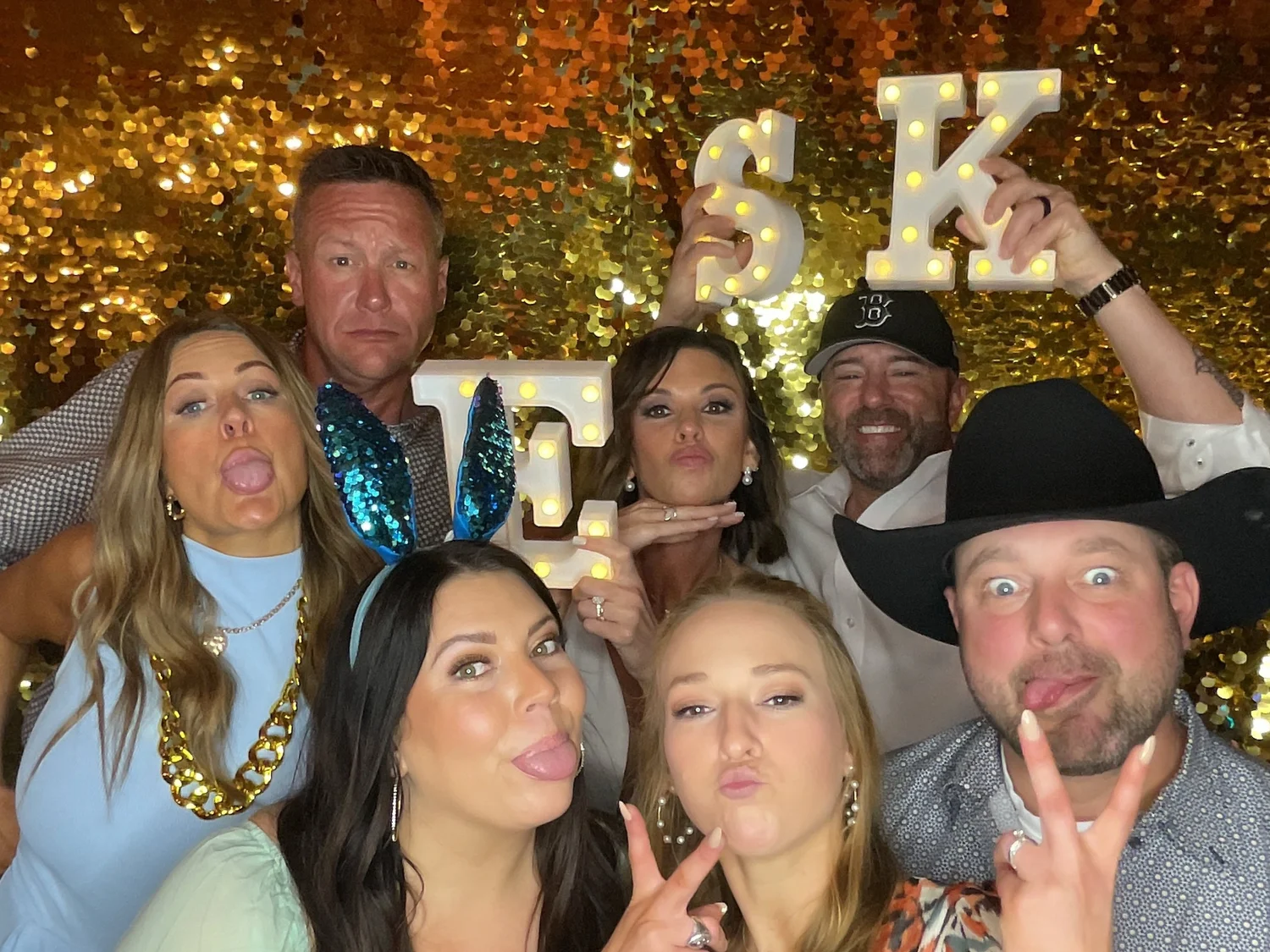 Guests having fun with a CheesyPix photo booth