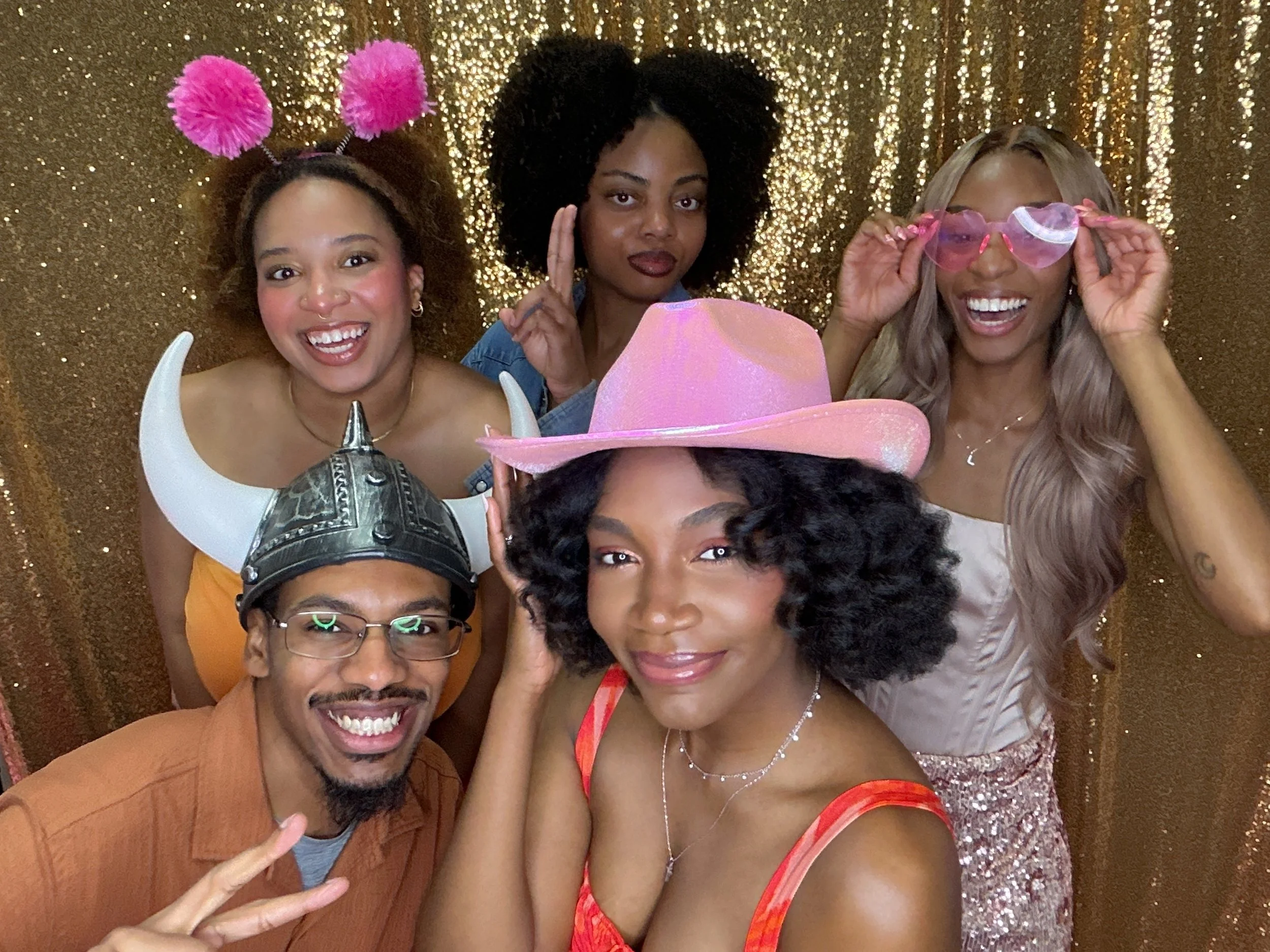 Guests posing together in a CheesyPix photo booth