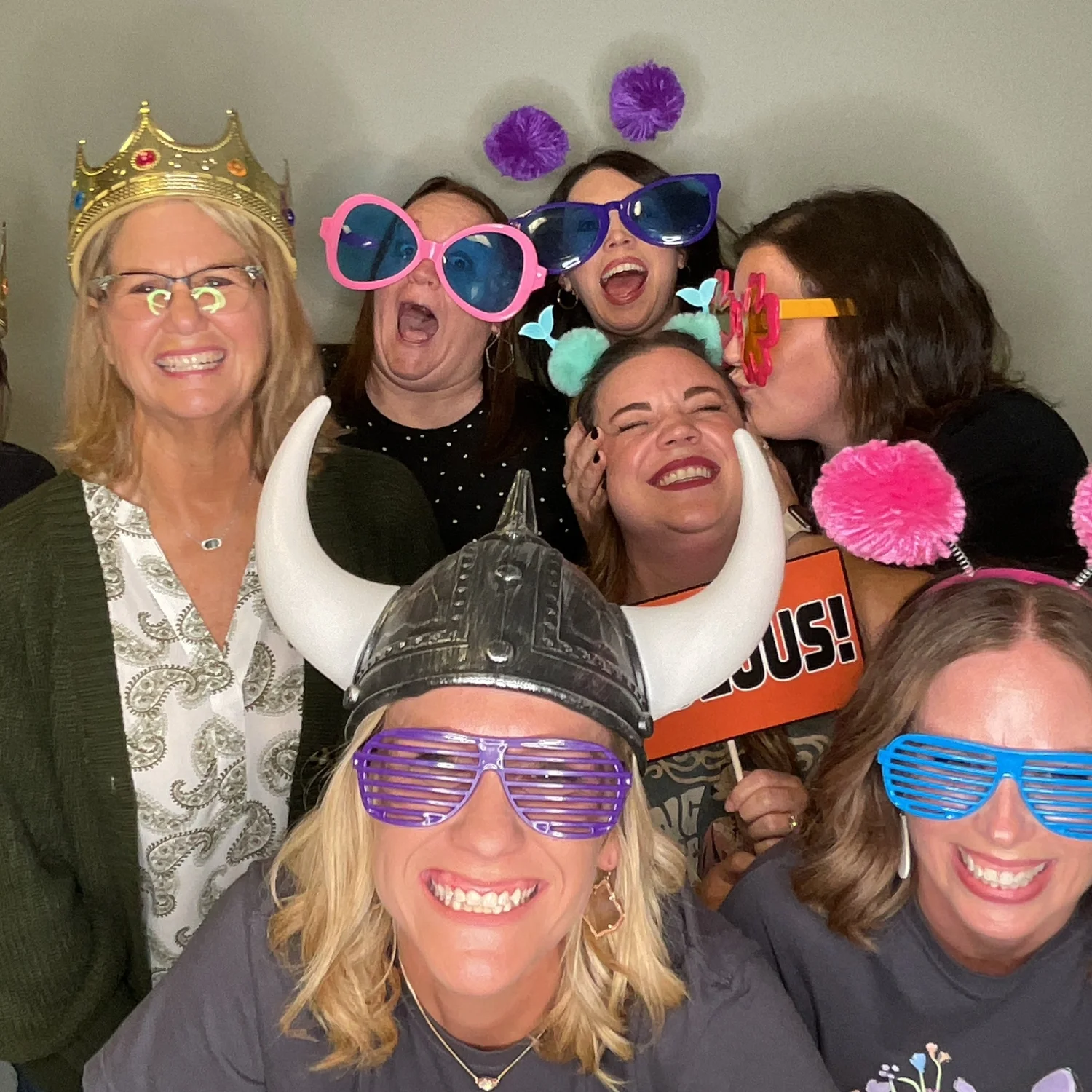 Friends having fun in the photo booth