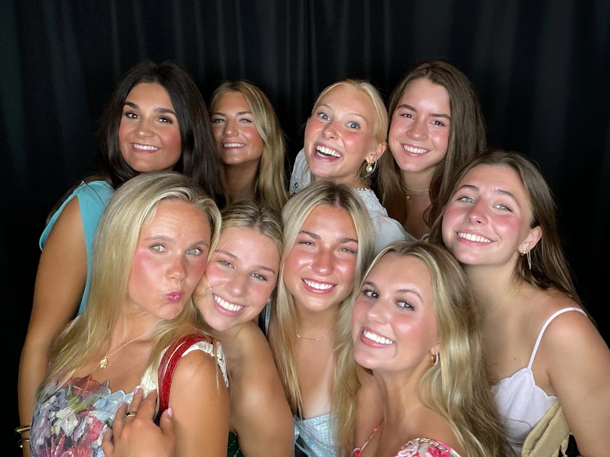 Students and friends having fun at a CheesyPix school event photo booth