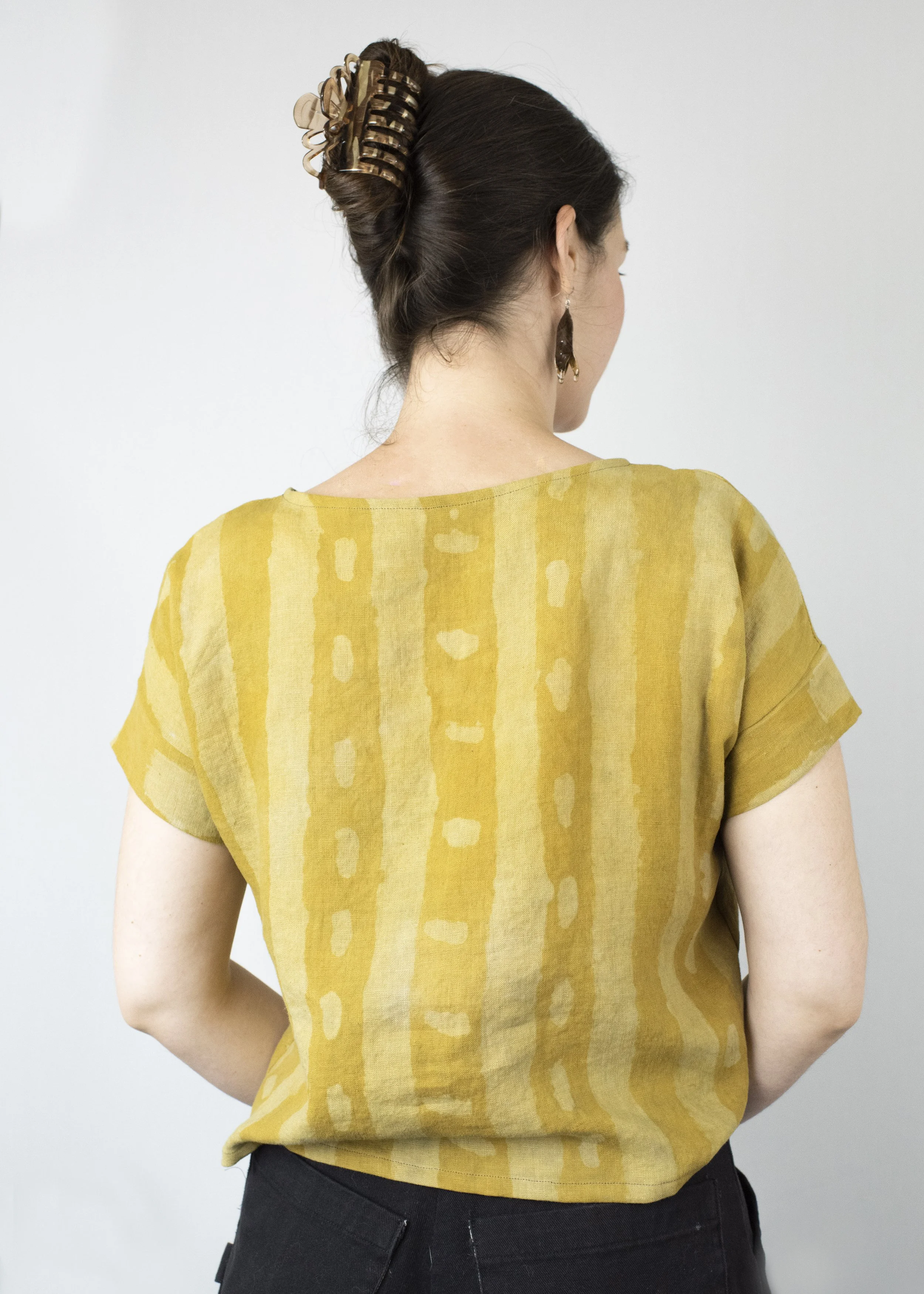 100% Linen Tee. Marigold dye with hand-painted resist. 2025.