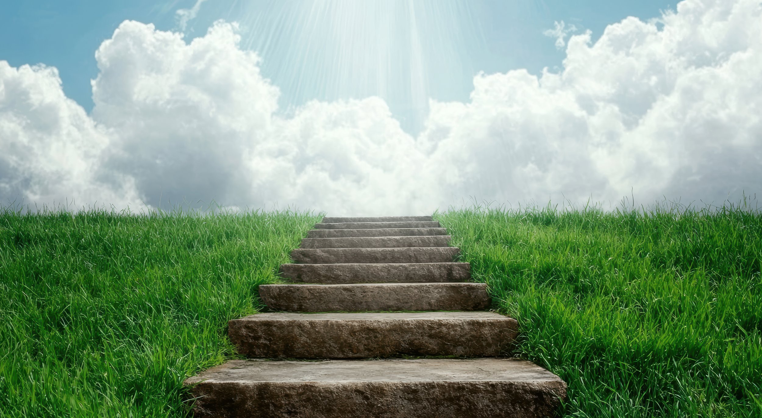 vecteezy_stone-steps-leading-to-heaven-through-bright-clouds_55376060.jpg
