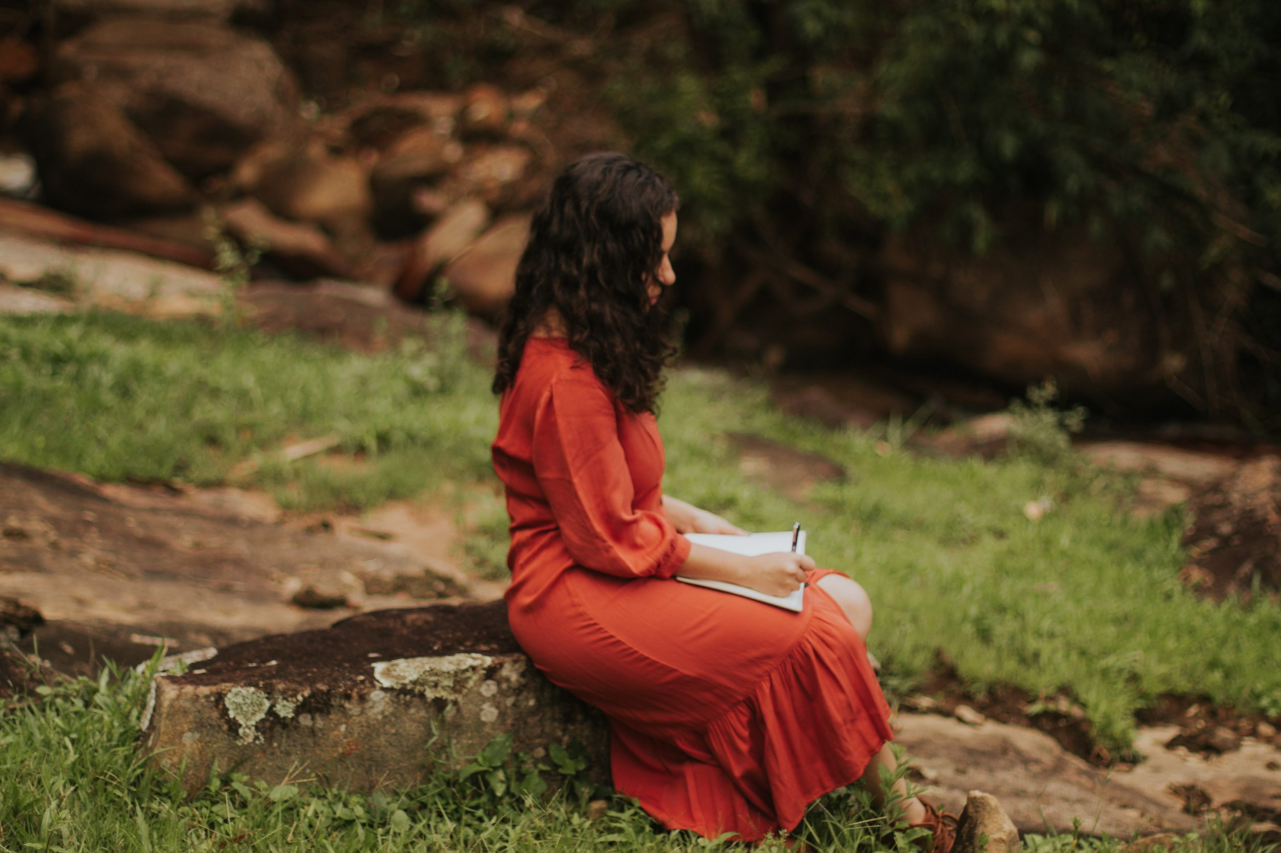 Black woman participating in an online acceptance and commitment therapy session from home