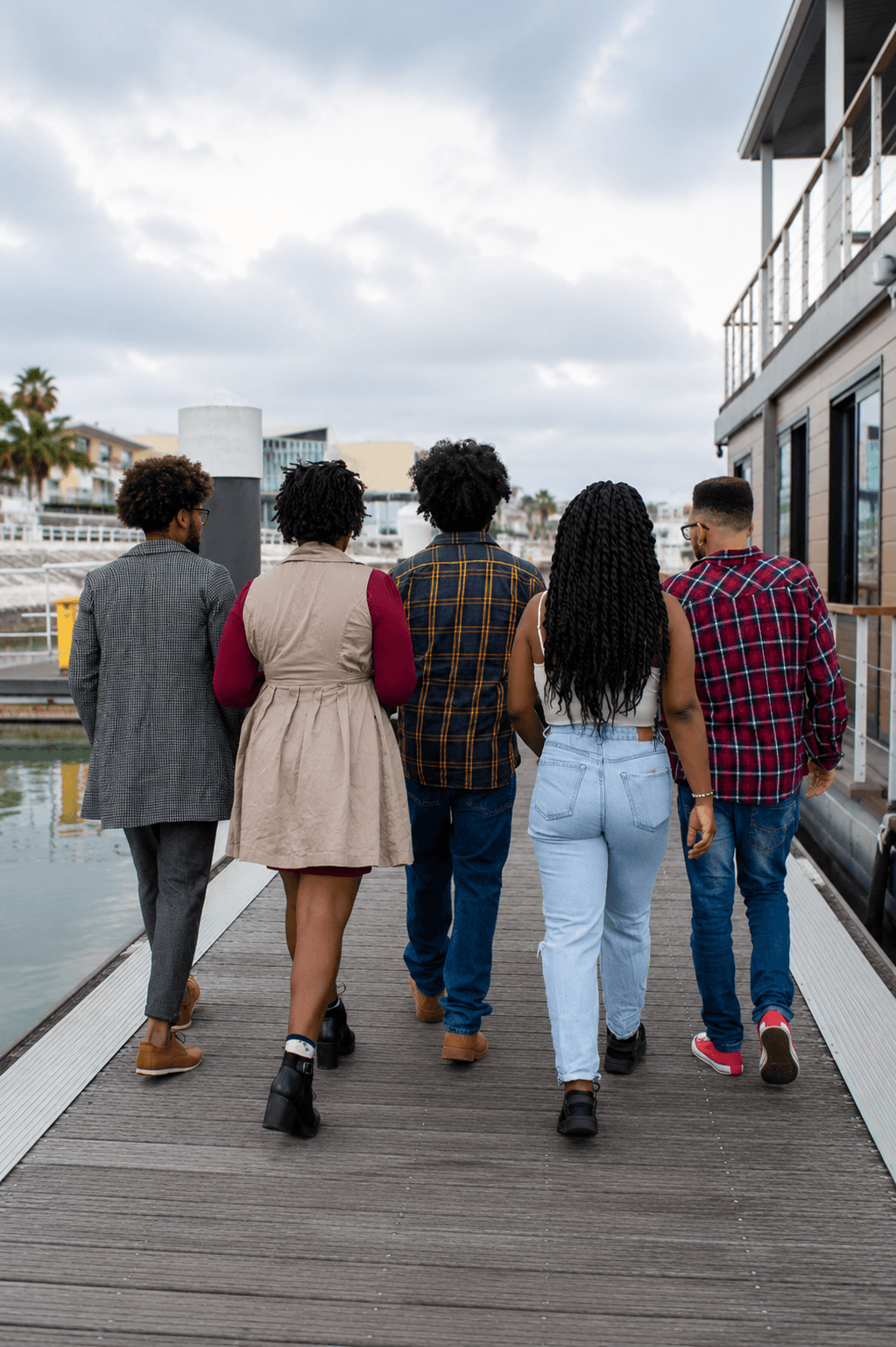 Diverse BIPOC adults walking together outdoors, symbolizing community support and online BIPOC therapy in California