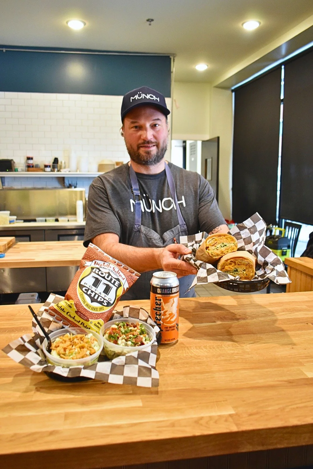 Chef Doug holding sandwich