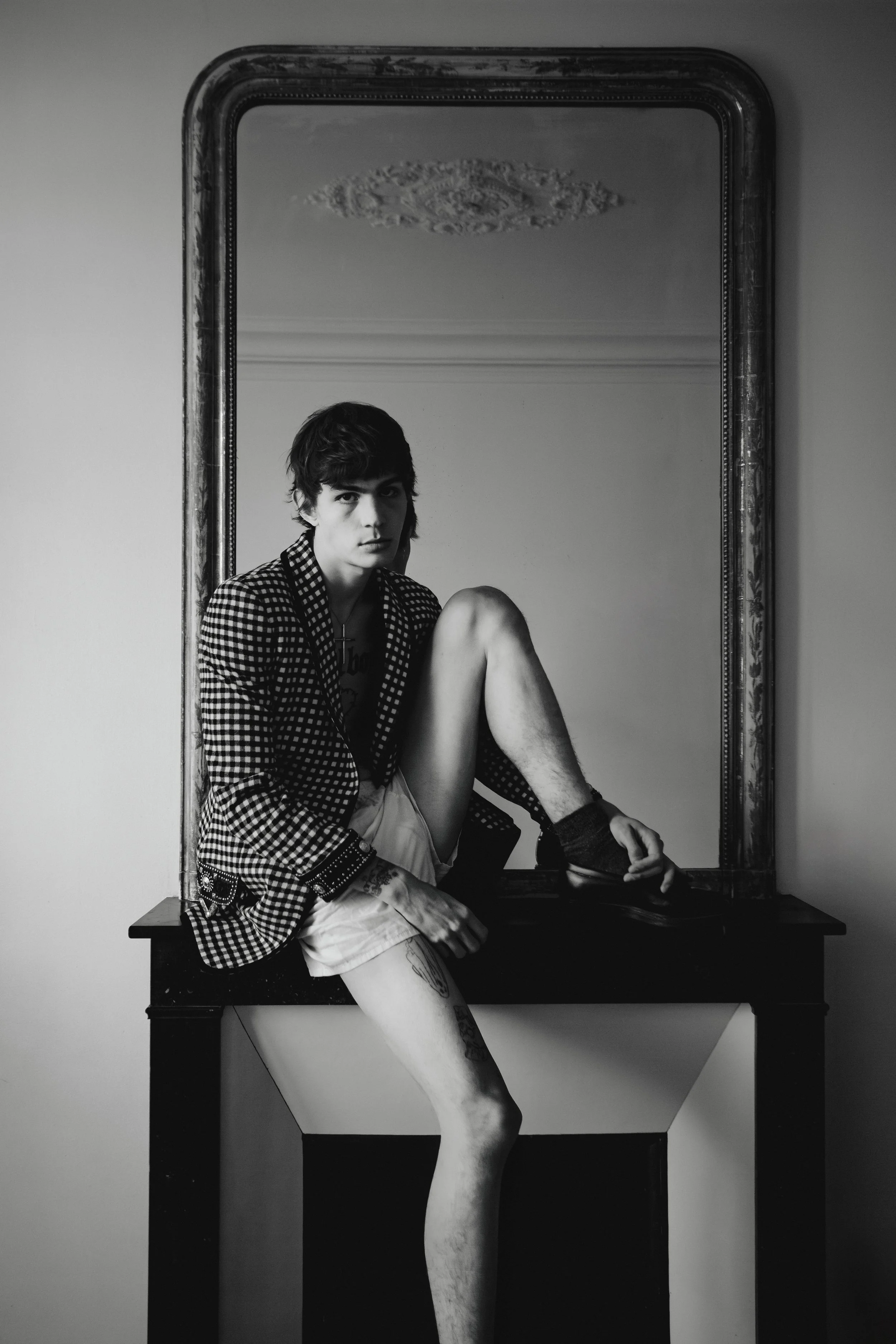 Seated fashion portrait in mirror for Selection Marais editorial, photographed by Ori Paul Levi.
