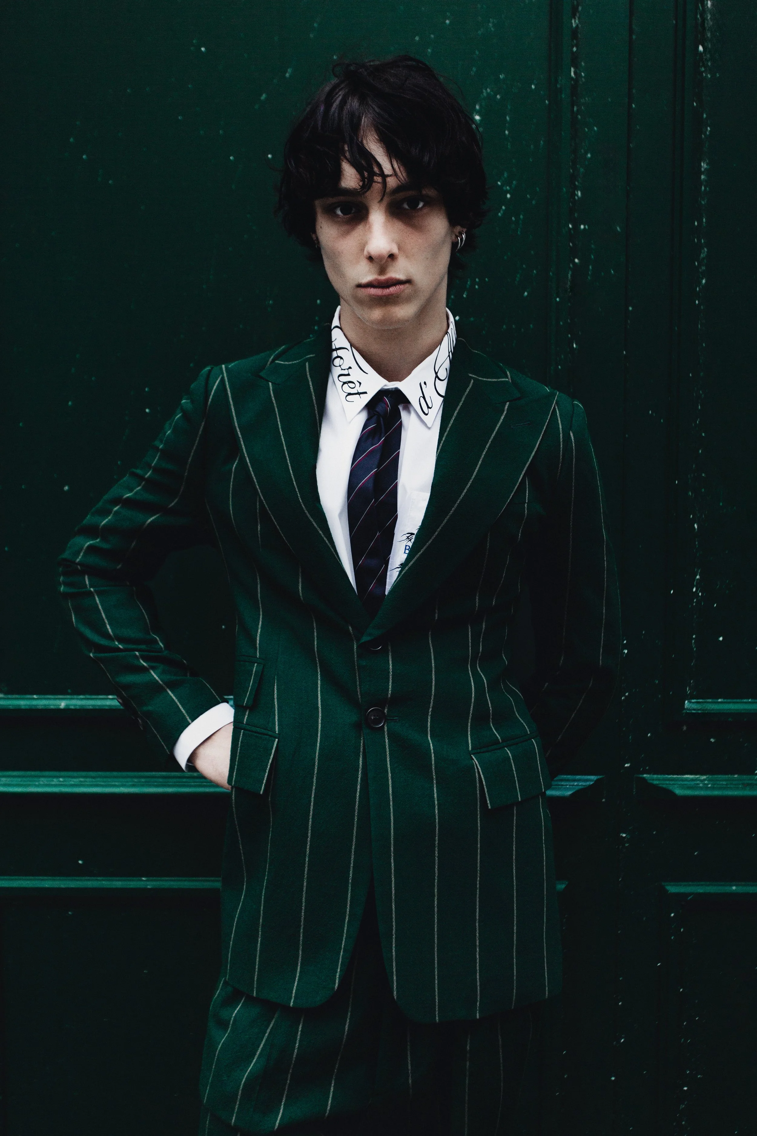 Editorial fashion portrait by Ori Paul Levi of a male model in a Vivienne Westwood pinstripe suit for Selection Marais, Paris