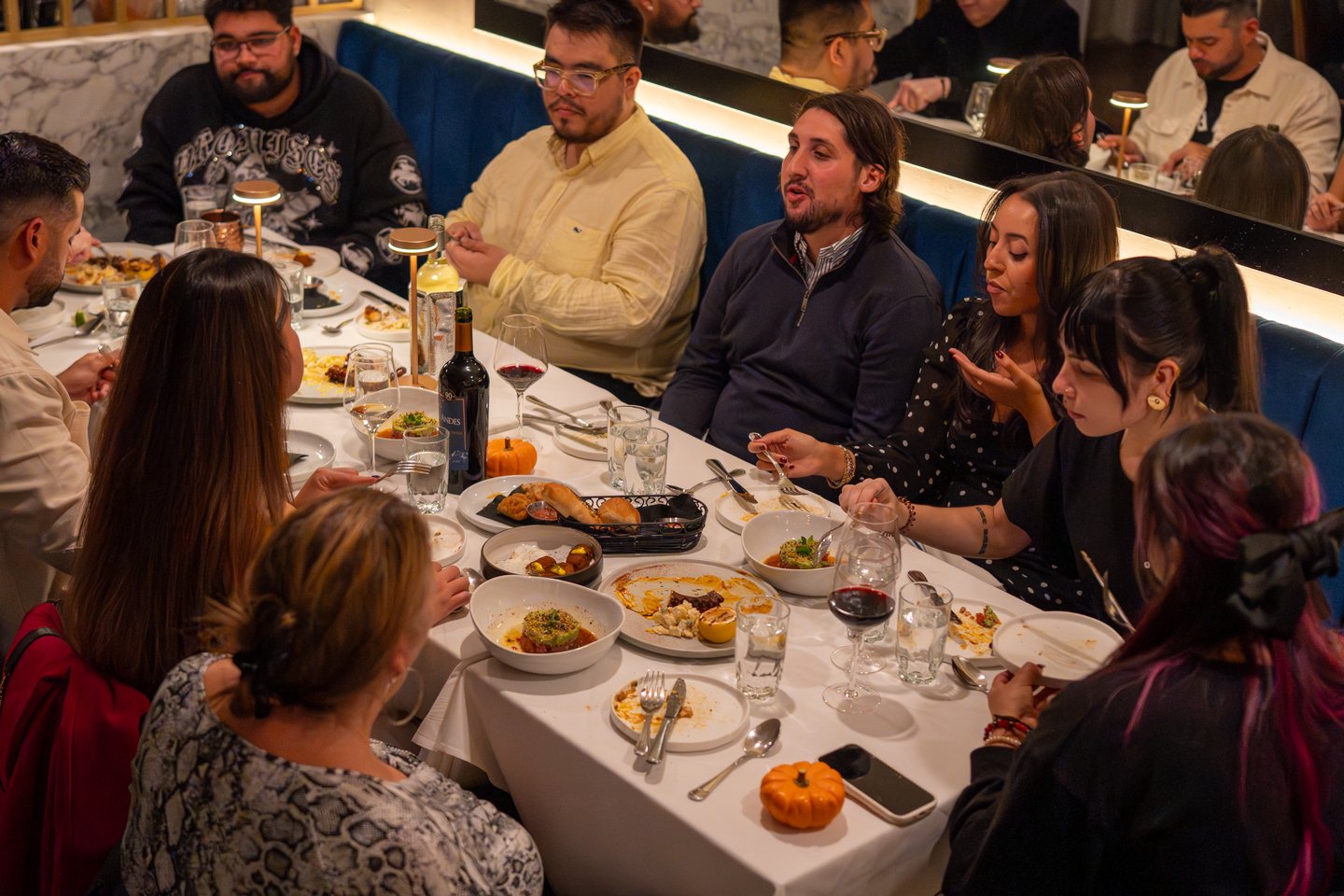 people eating at a full table in Palermo gramercy