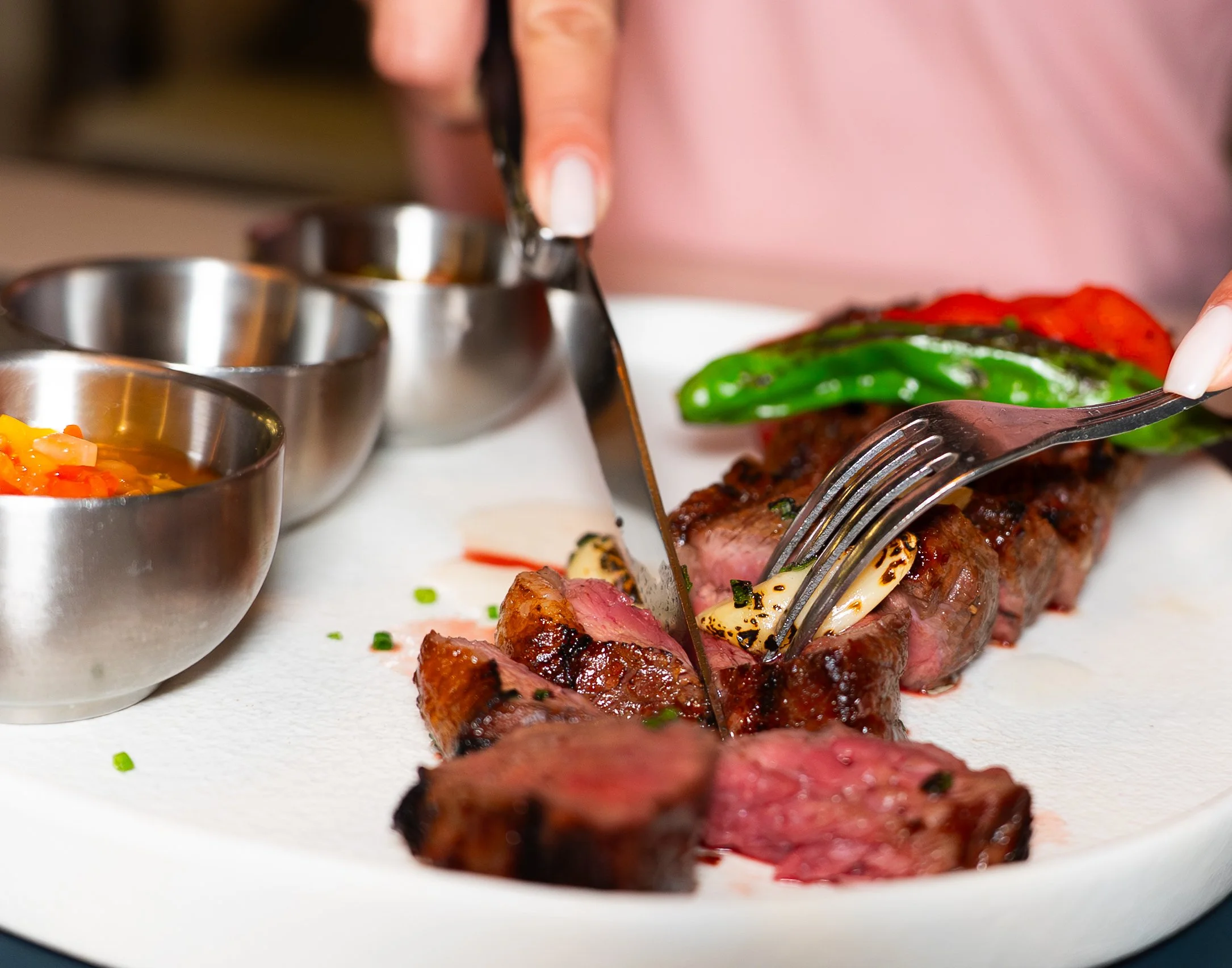 delicious cut of meat with chimichurri, peppers and Argentiniam flavor