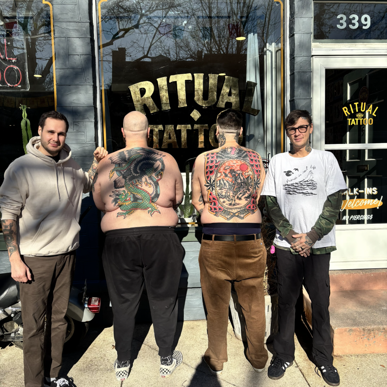 Ritual Tattoo Lancaster PA Joe Montalbano and Malachi Kelchner showing off two large american traditional back pieces.