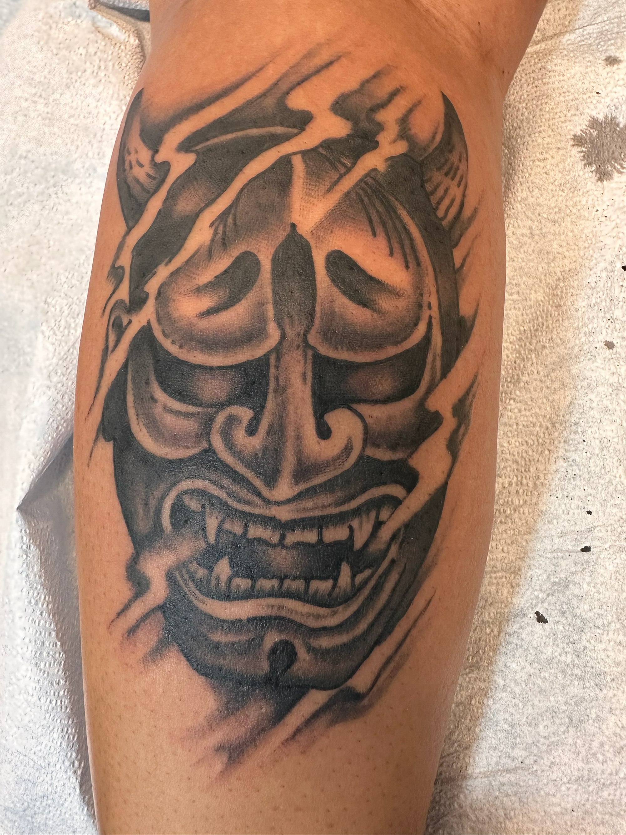 black and grey japanese traditional hannya mask tattoo