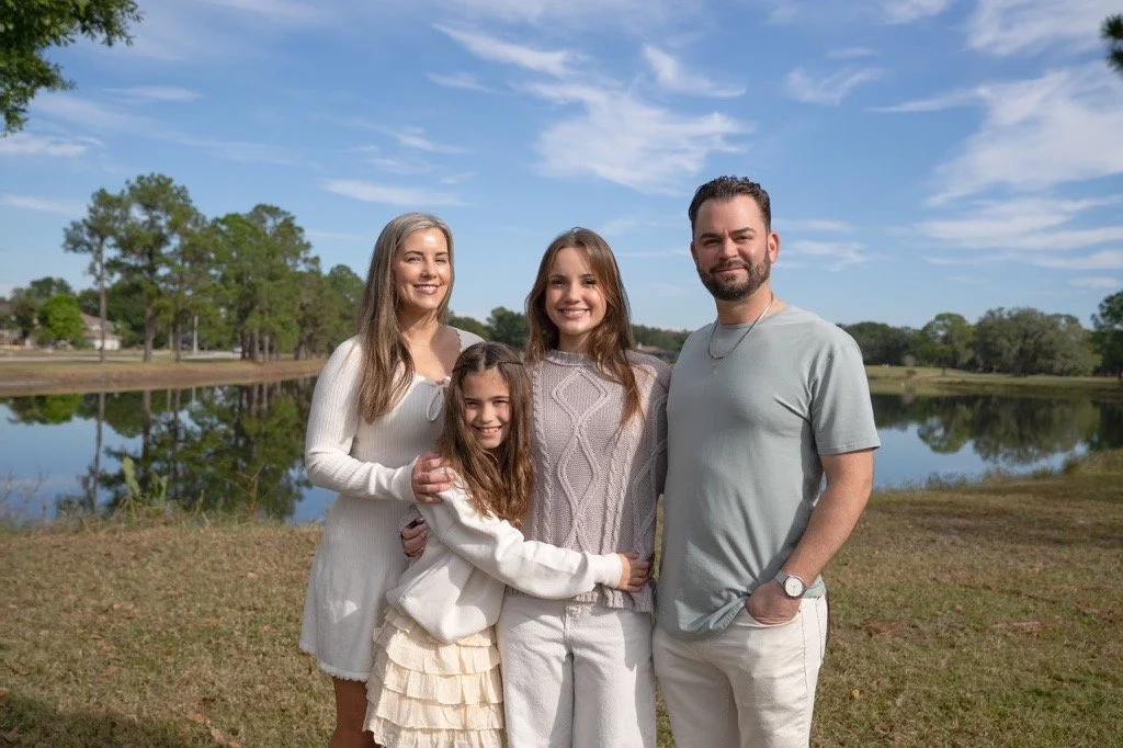 Family of 4 outside.