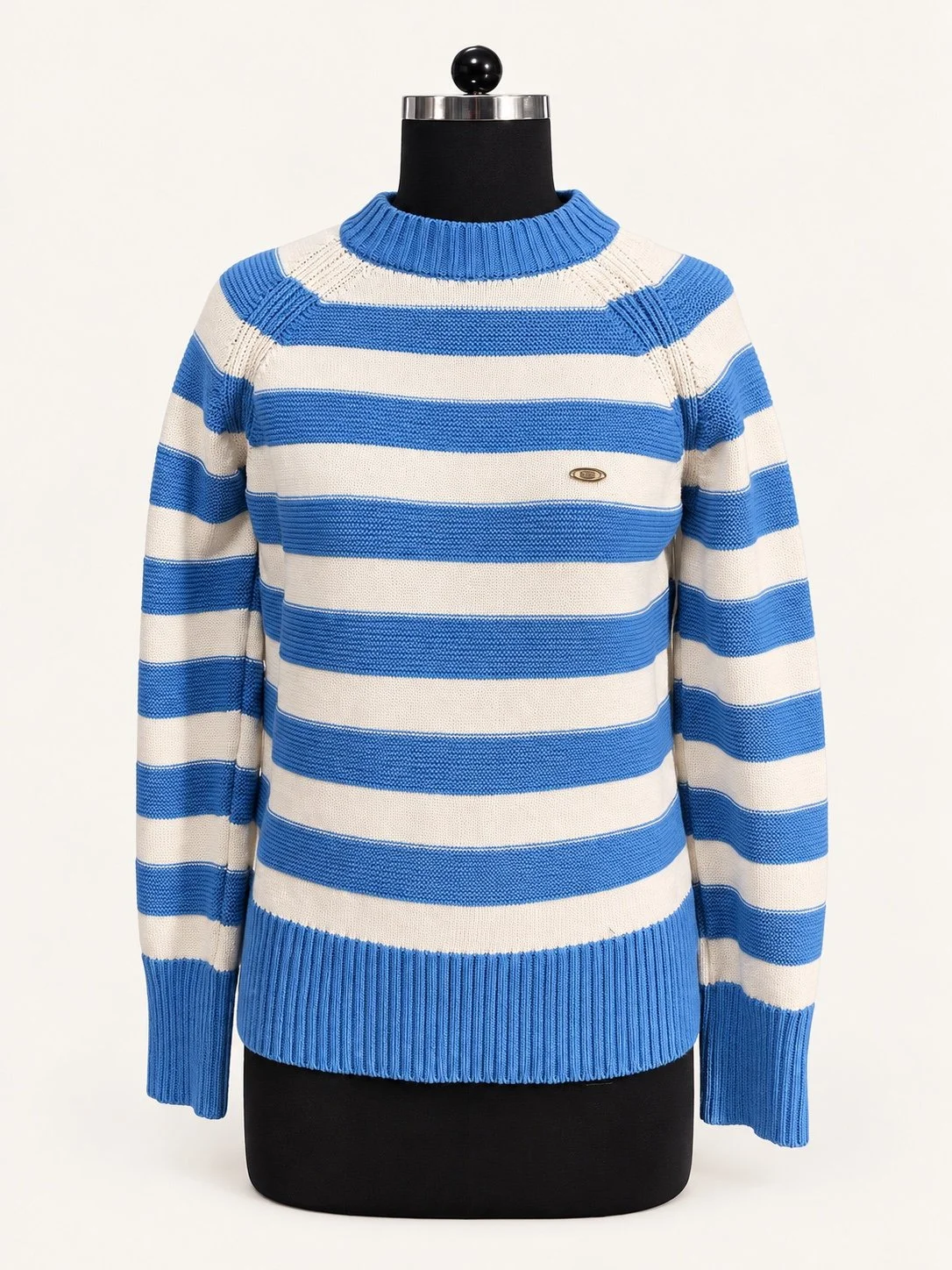 Blue and ivory striped crew-neck knit sweater, displayed on a dress form.