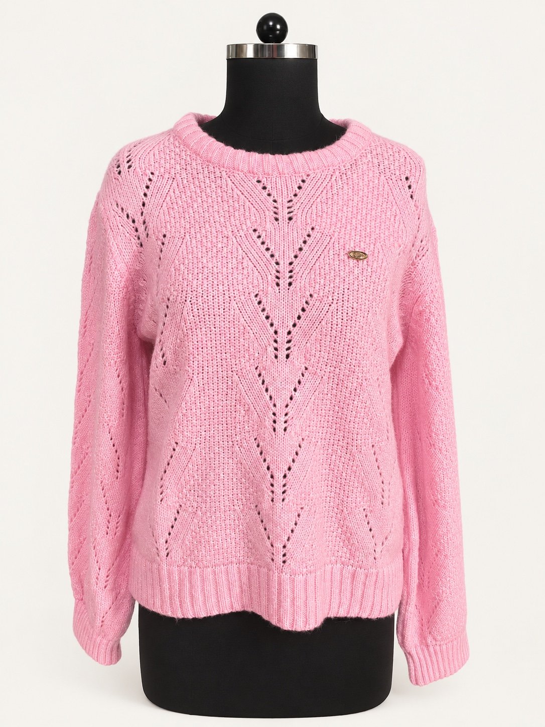 Pink pointelle-knit crew-neck sweater with long sleeves, displayed on a dress form.