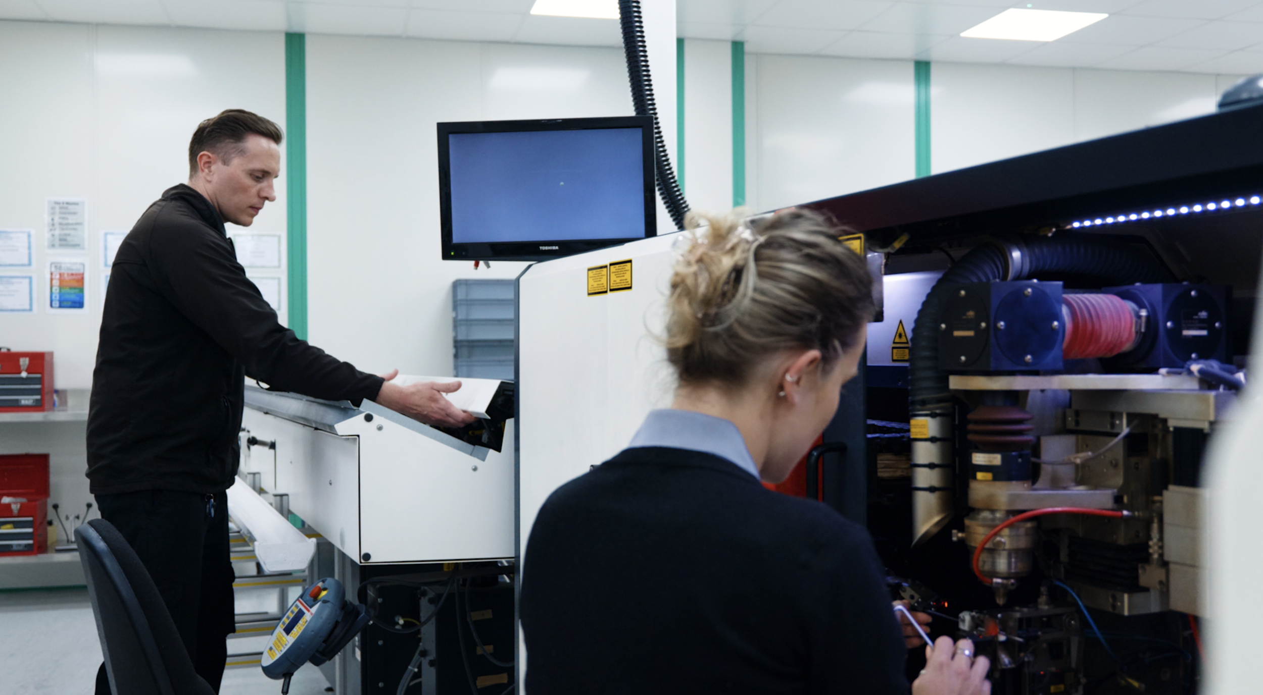 Elevaris technicians reviewing and testing components during medical device product development and manufacturing.