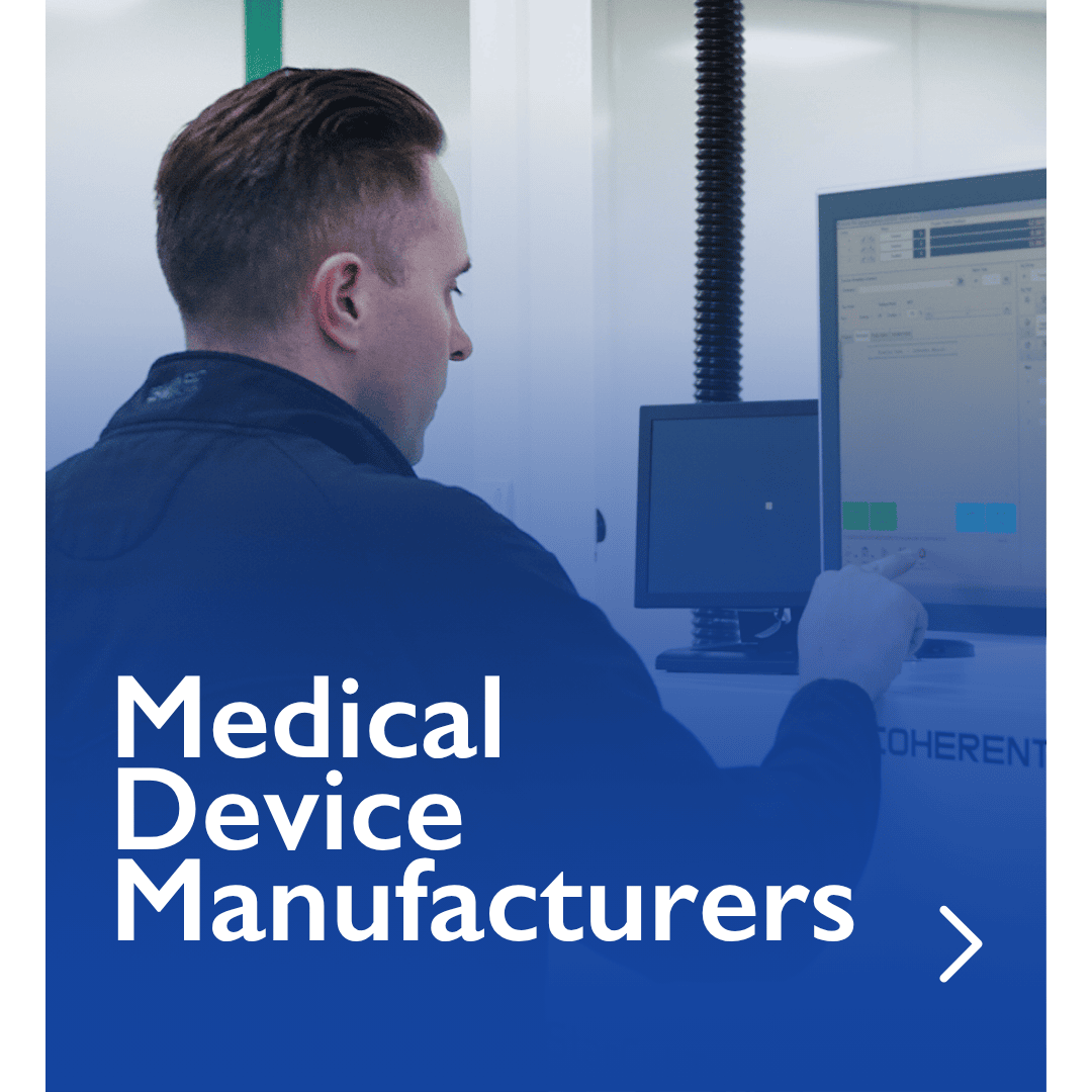 Elevaris lab professional using computer for medical device manufacturing.