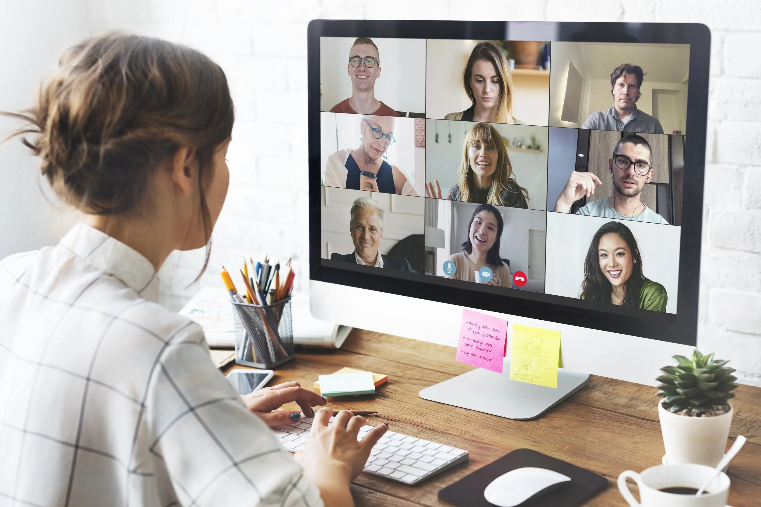 Image of a woman in a virtual meeting, representing accessible online corporate wellness webinars by Guidance Teletherapy