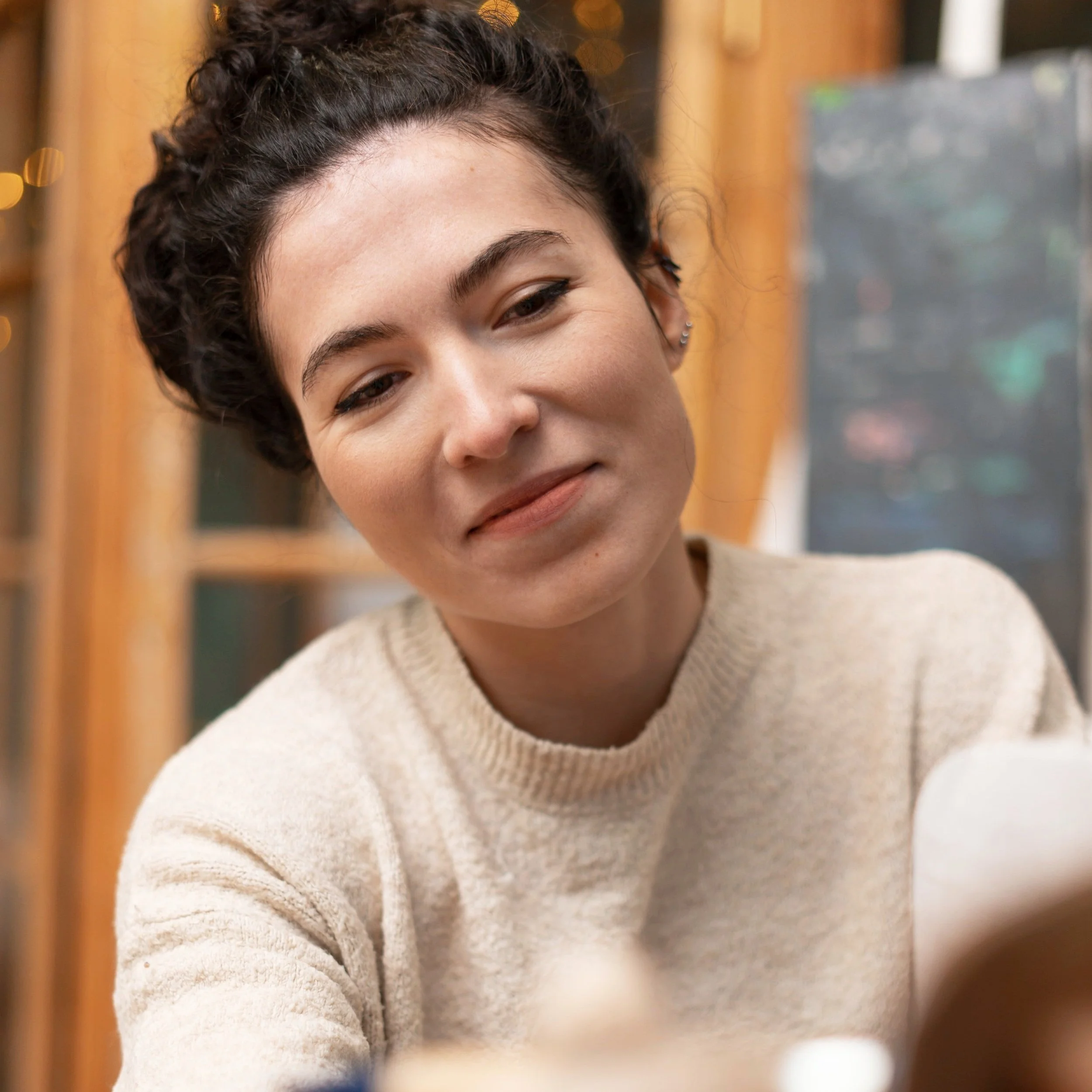 Person focused on restoring furniture by hand conveying presence creativity and a grounded sense of purpose after therapy with Guidance Teletherapy