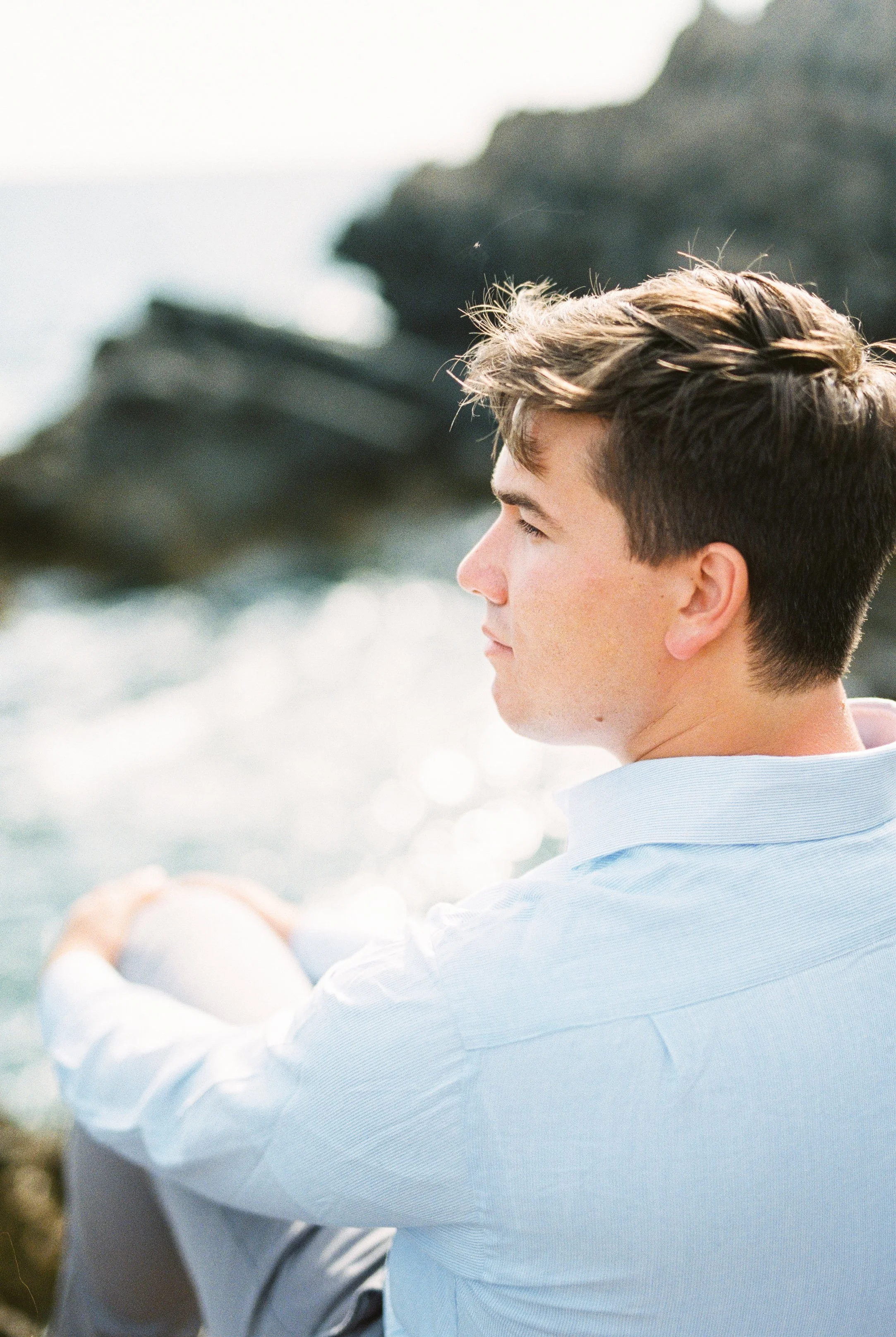 Young woman looking away in quiet reflection representing courage healing and the careful evaluation process supported through Guidance Teletherapy’s Certificate of Merit assessments
