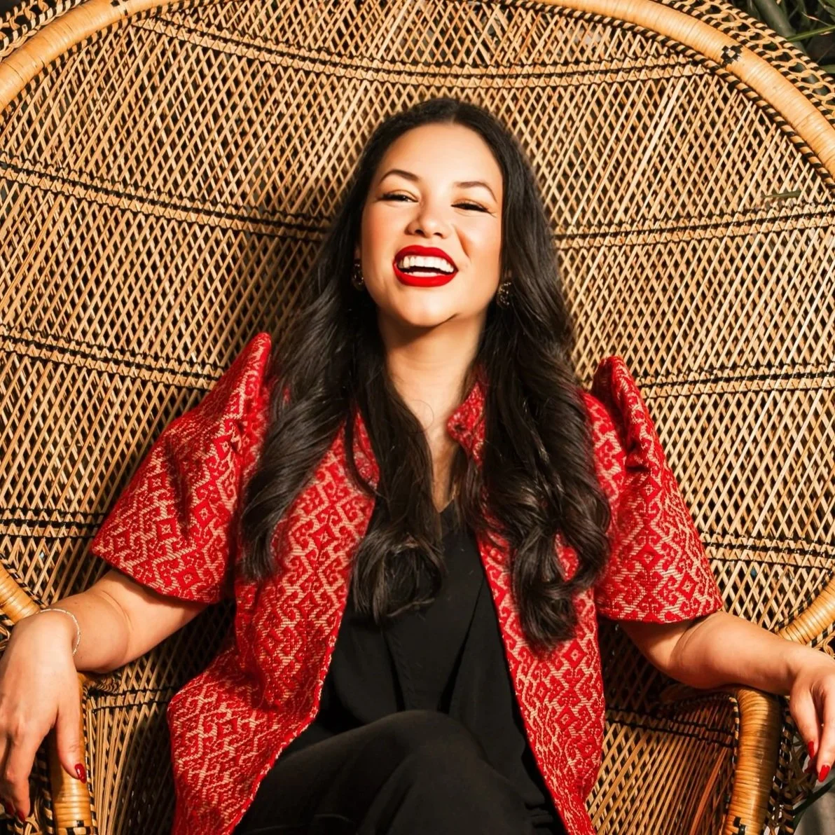 Image of Ariel Landrum, LMFT, ATR, smiling confidently. Licensed therapist and founder of Guidance Teletherapy, specializing in culturally responsive, trauma-informed care