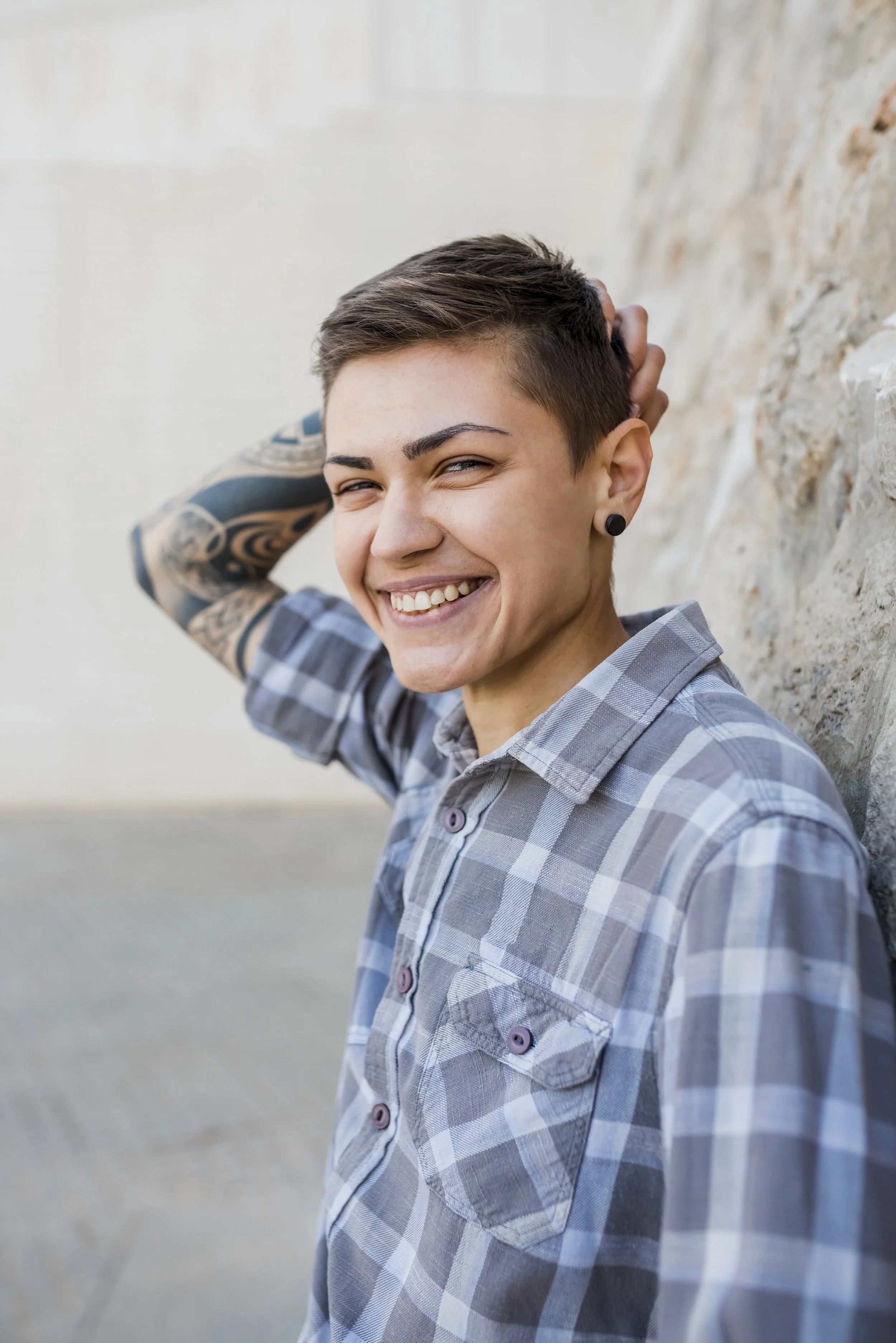 Image of a young person laughing joyfully, representing authenticity, neurodivergent confidence, and the power of embracing one's unique mind